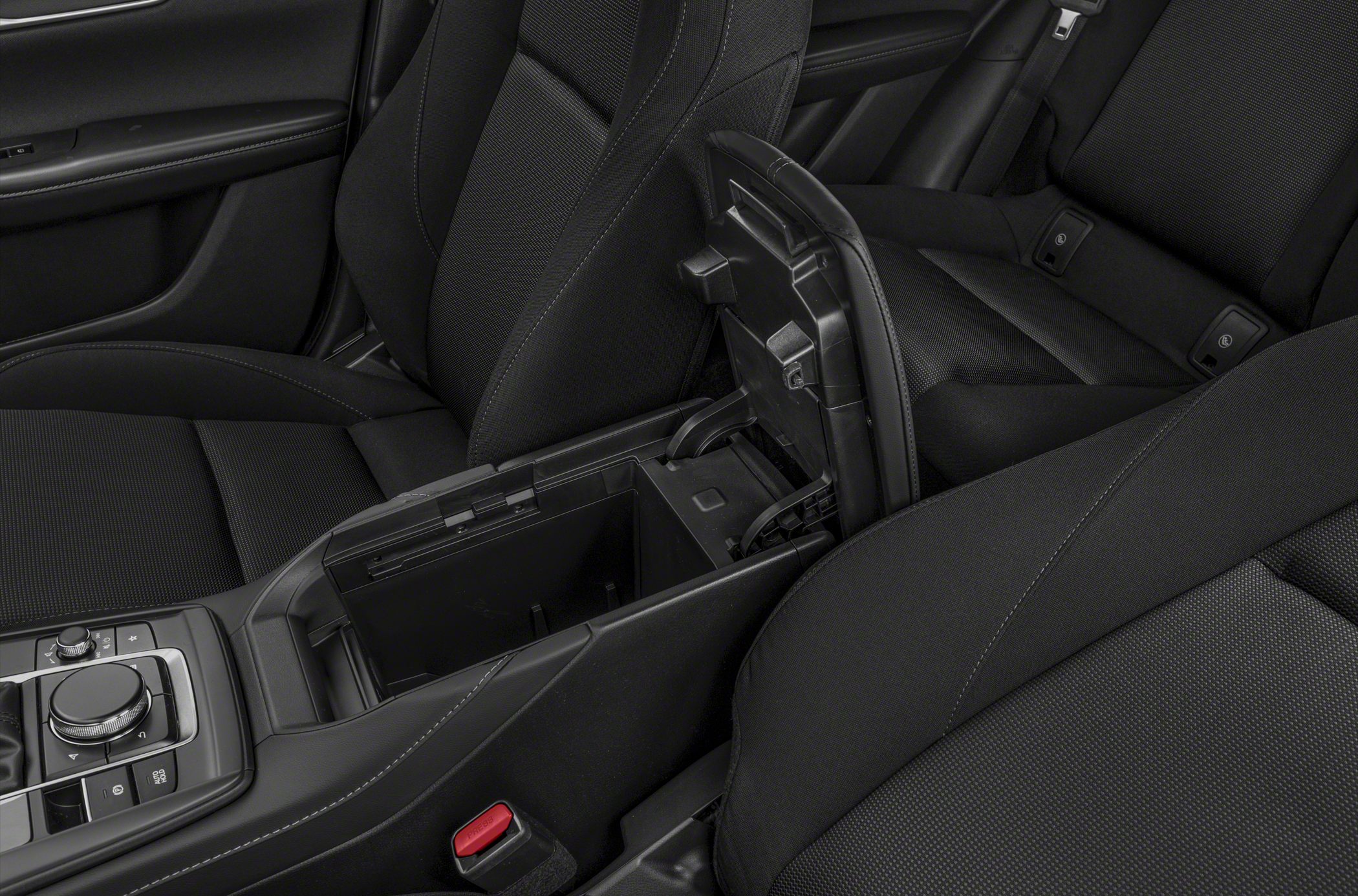 Center console storage compartment with control dials and black fabric seats