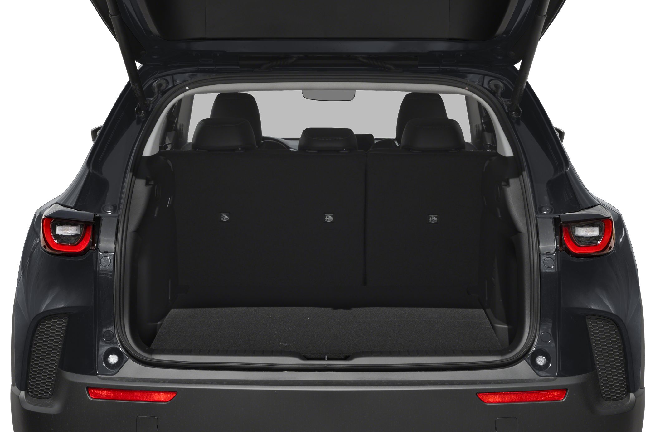 Open rear cargo space with upright seats and visible headrests
