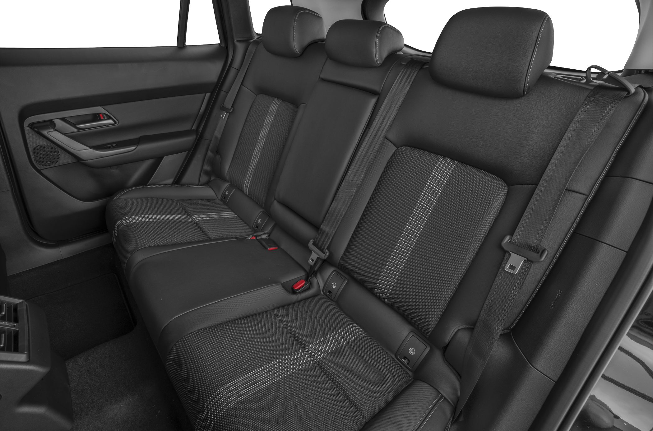 Rear seat interior with upholstery, headrests, and seat belts.