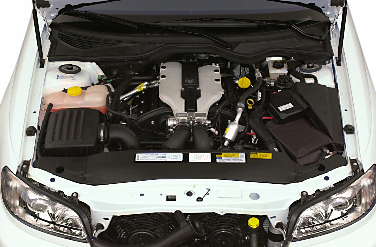 Engine bay with V6 engine and components in a 1997 sedan