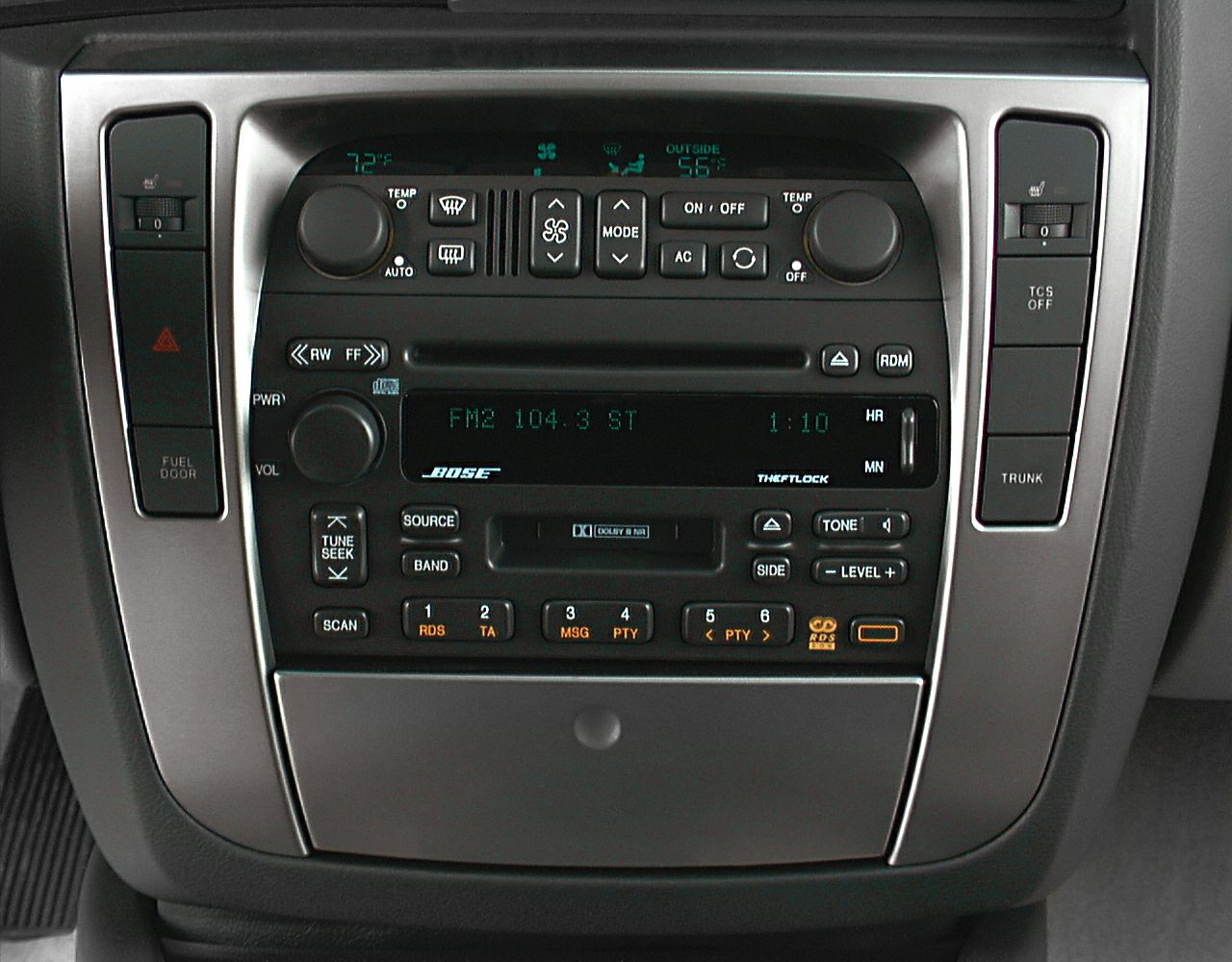 Dashboard with radio and climate control panel featuring temperature knobs and seat heater switches.