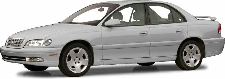 Silver sedan front side view with alloy wheels and classic body lines.