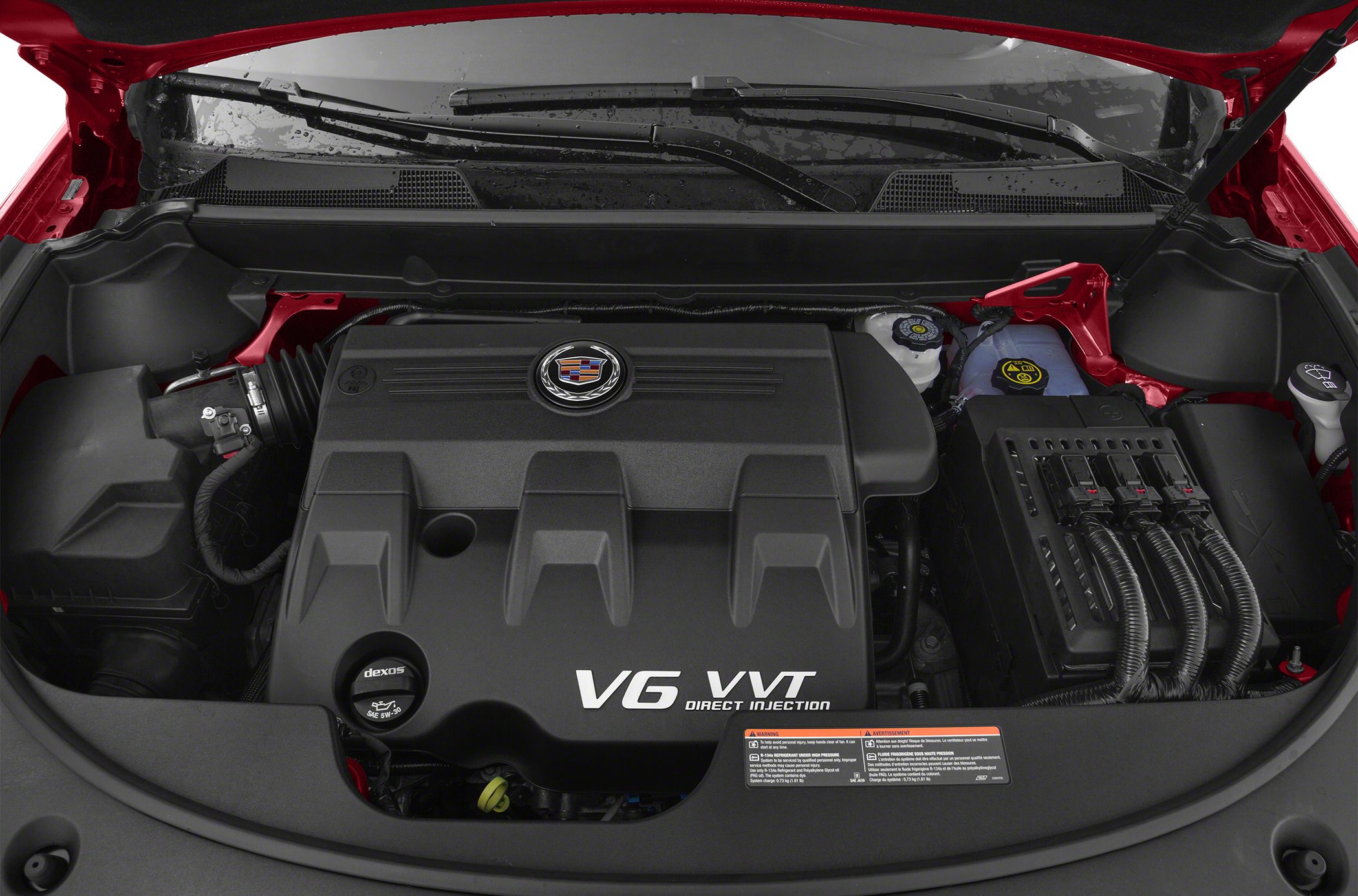 V6 VVT direct injection engine bay with Cadillac emblem and engine cover