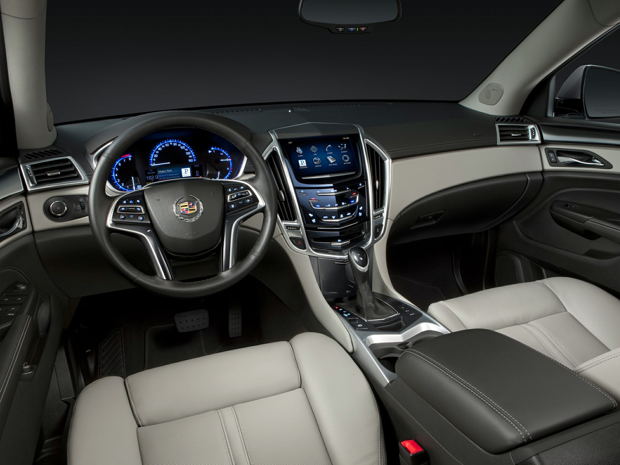 Digital instrument cluster and touchscreen infotainment in luxury car interior