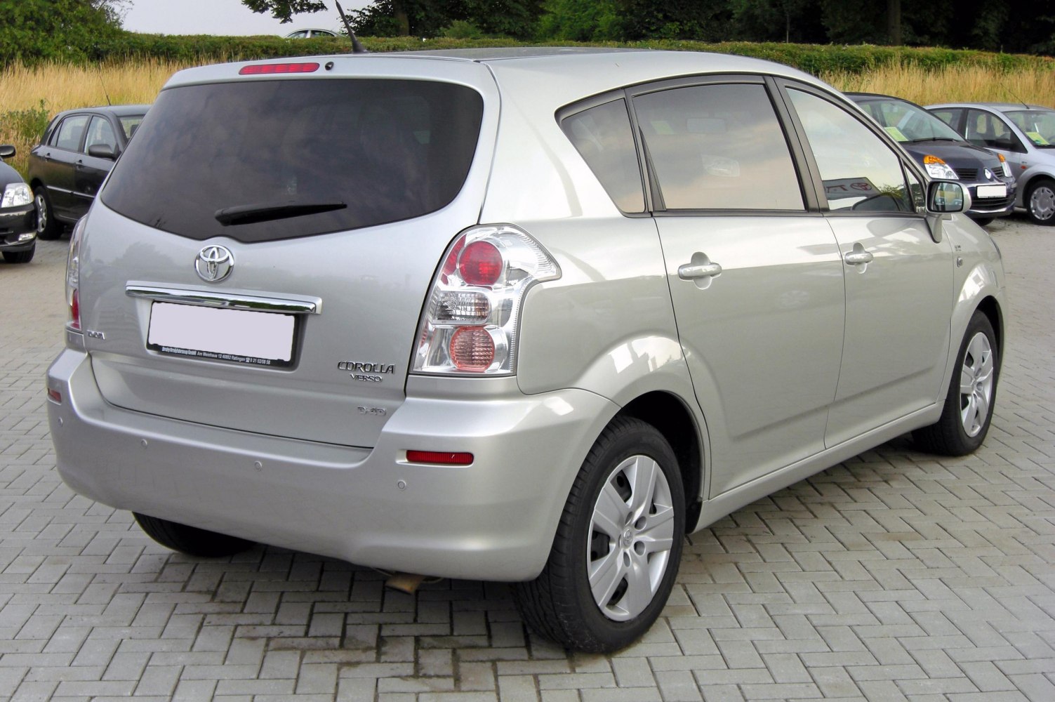 Rear and side profile with tail lights and tinted windows