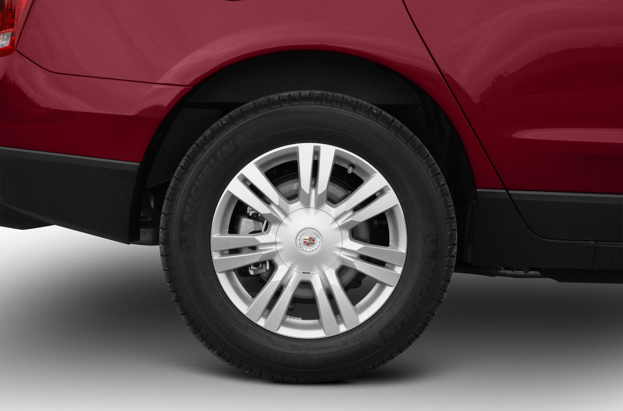 Close-up of alloy wheel and rear quarter panel with tire