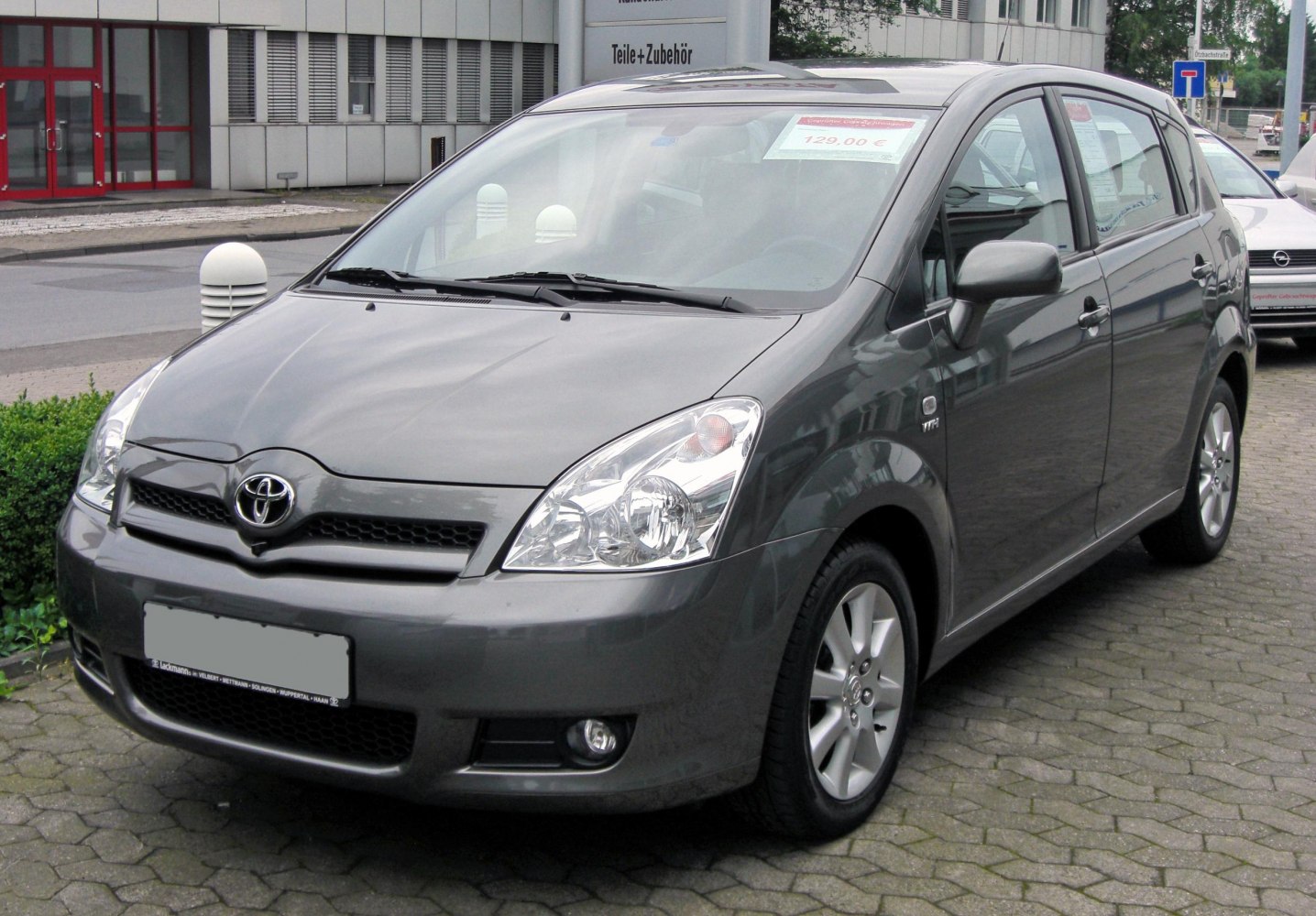 Compact hatchback front view with alloy wheels