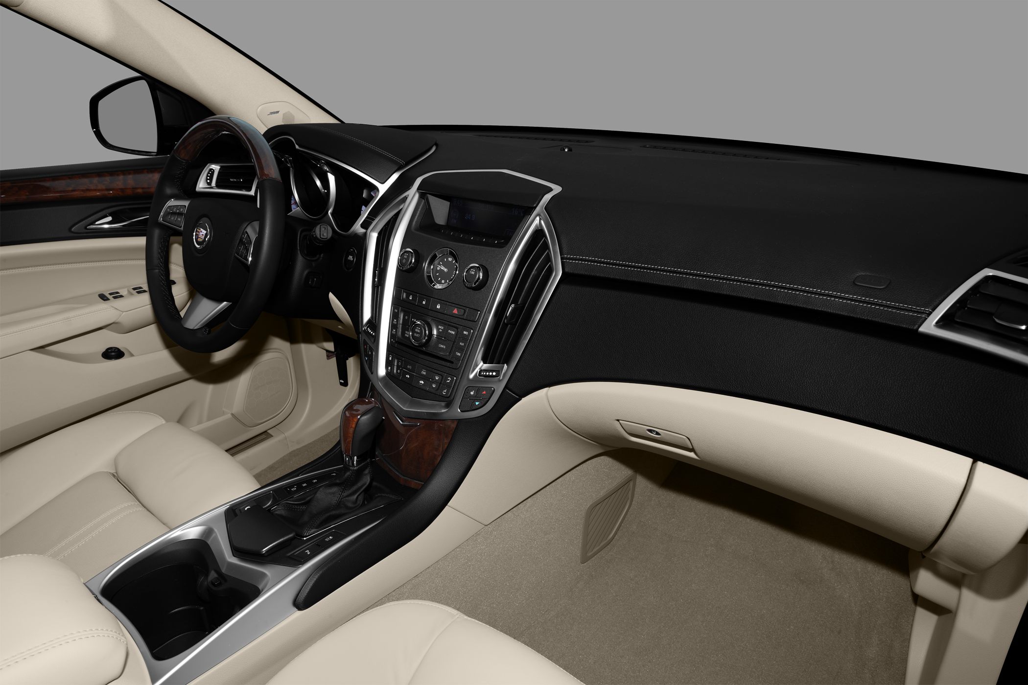 Beige leather interior with wood trim and center console controls