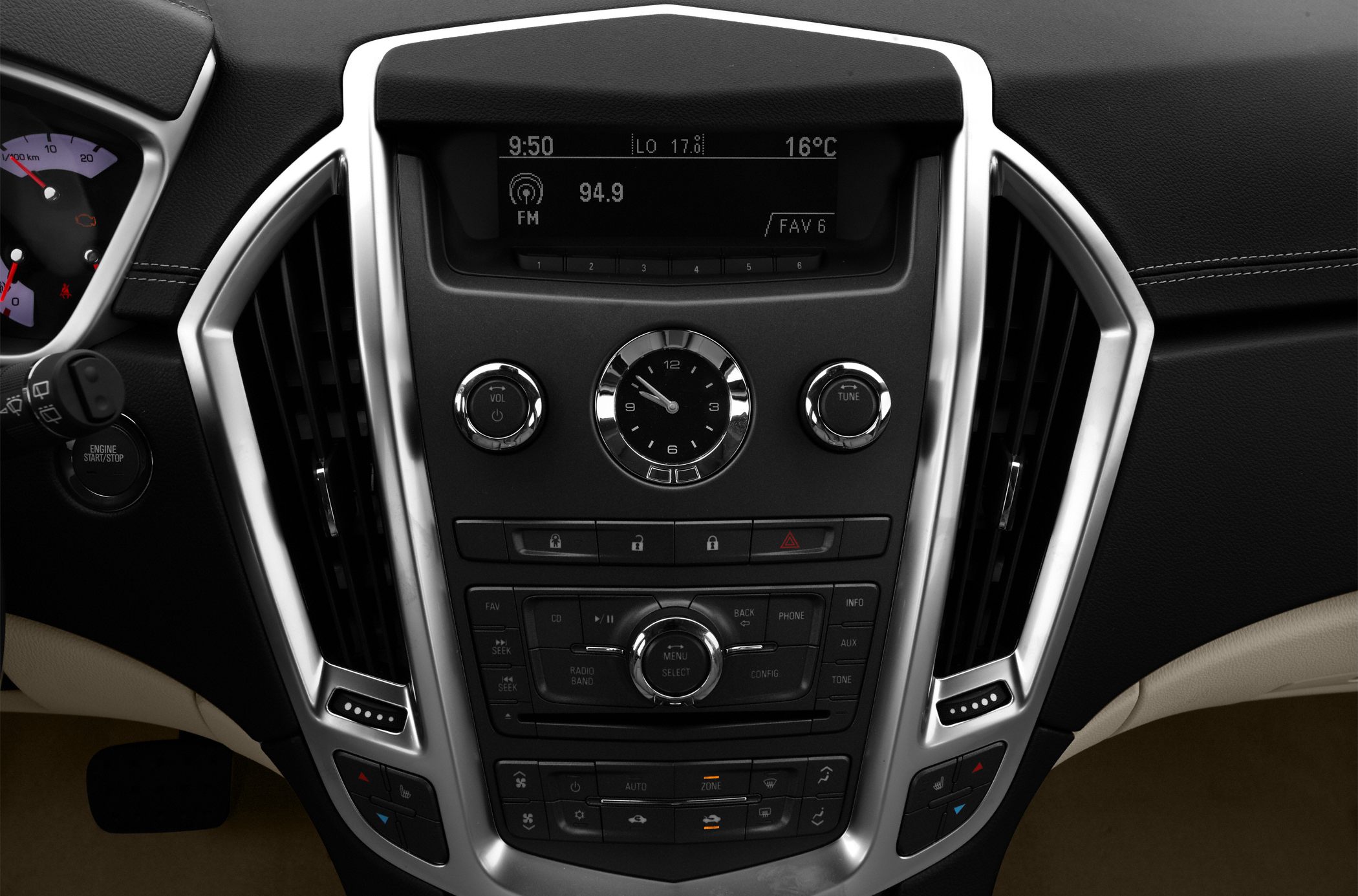 Center console with analog clock, audio controls, and climate control panel