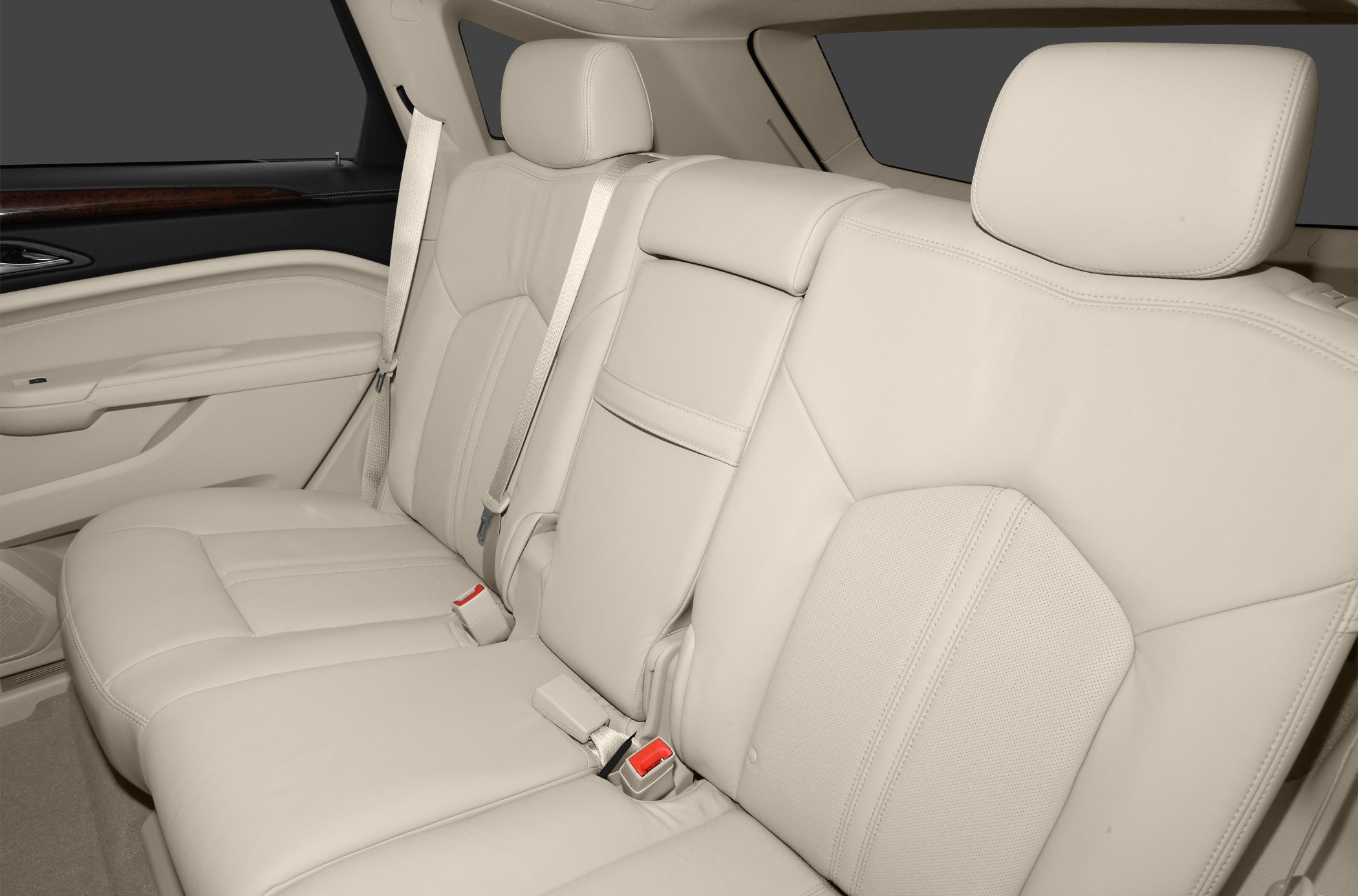 Beige leather rear seats with headrests and seat belts