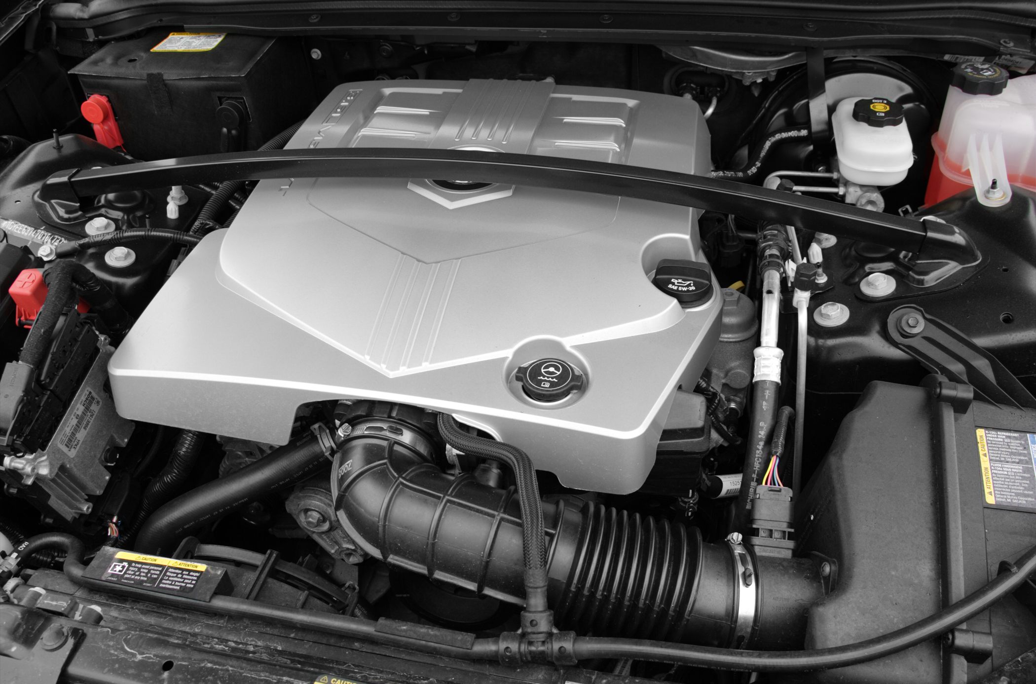 Close-up of engine bay with prominent engine cover and components