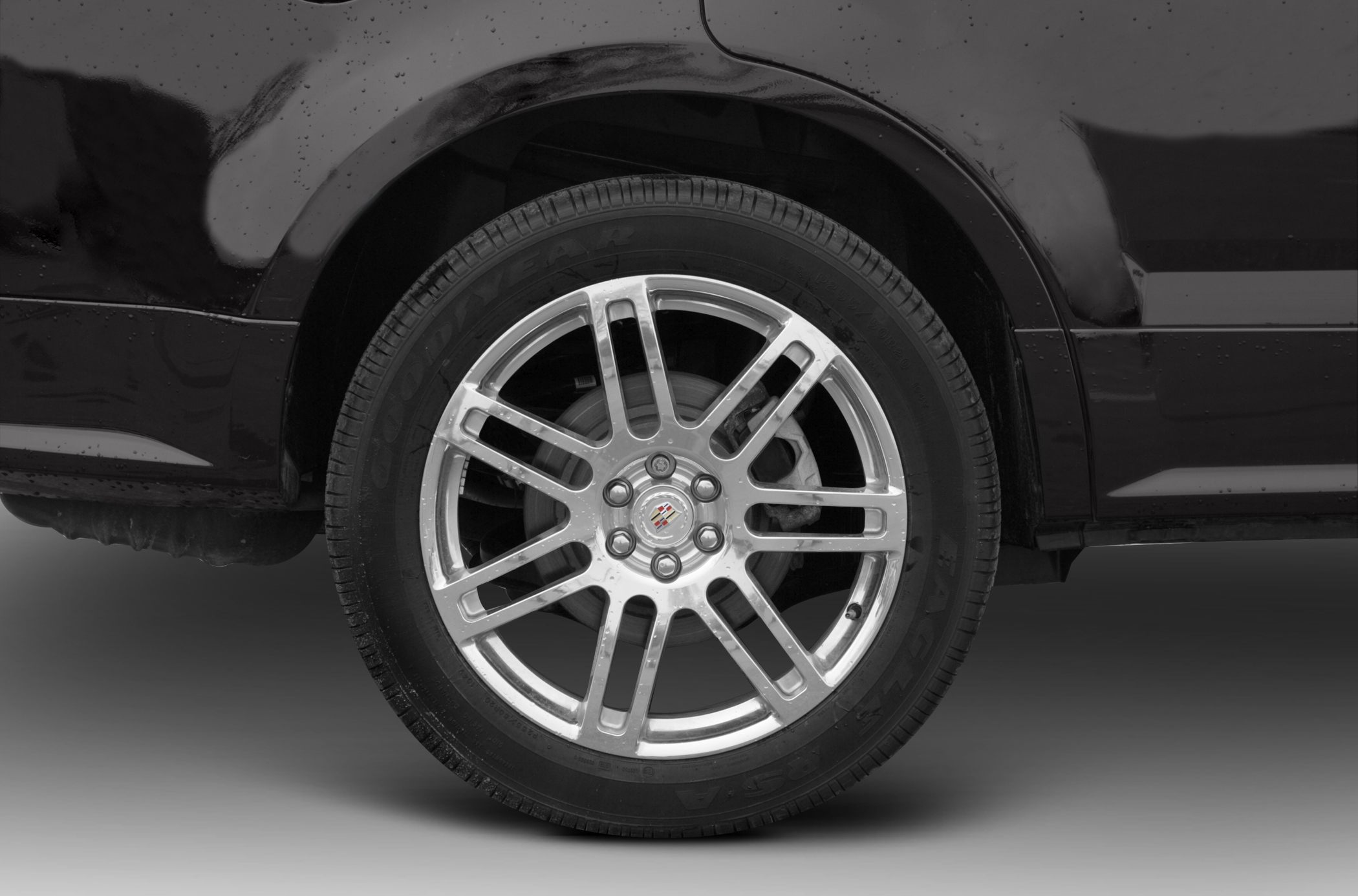 Close-up of alloy wheel and Goodyear tire on vehicle