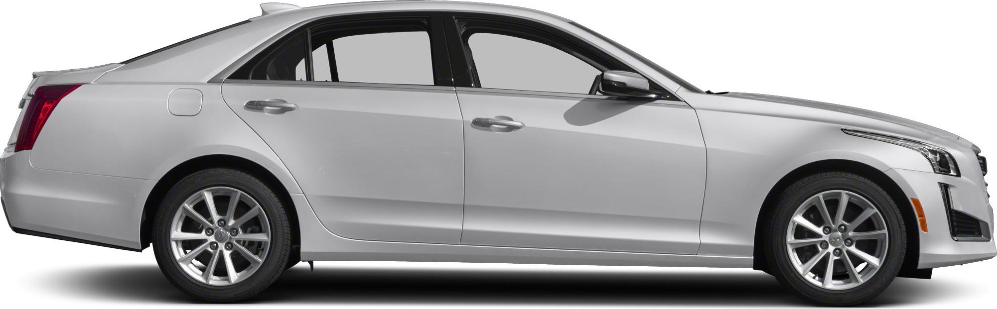 Side profile of silver sedan with alloy wheels and modern headlights