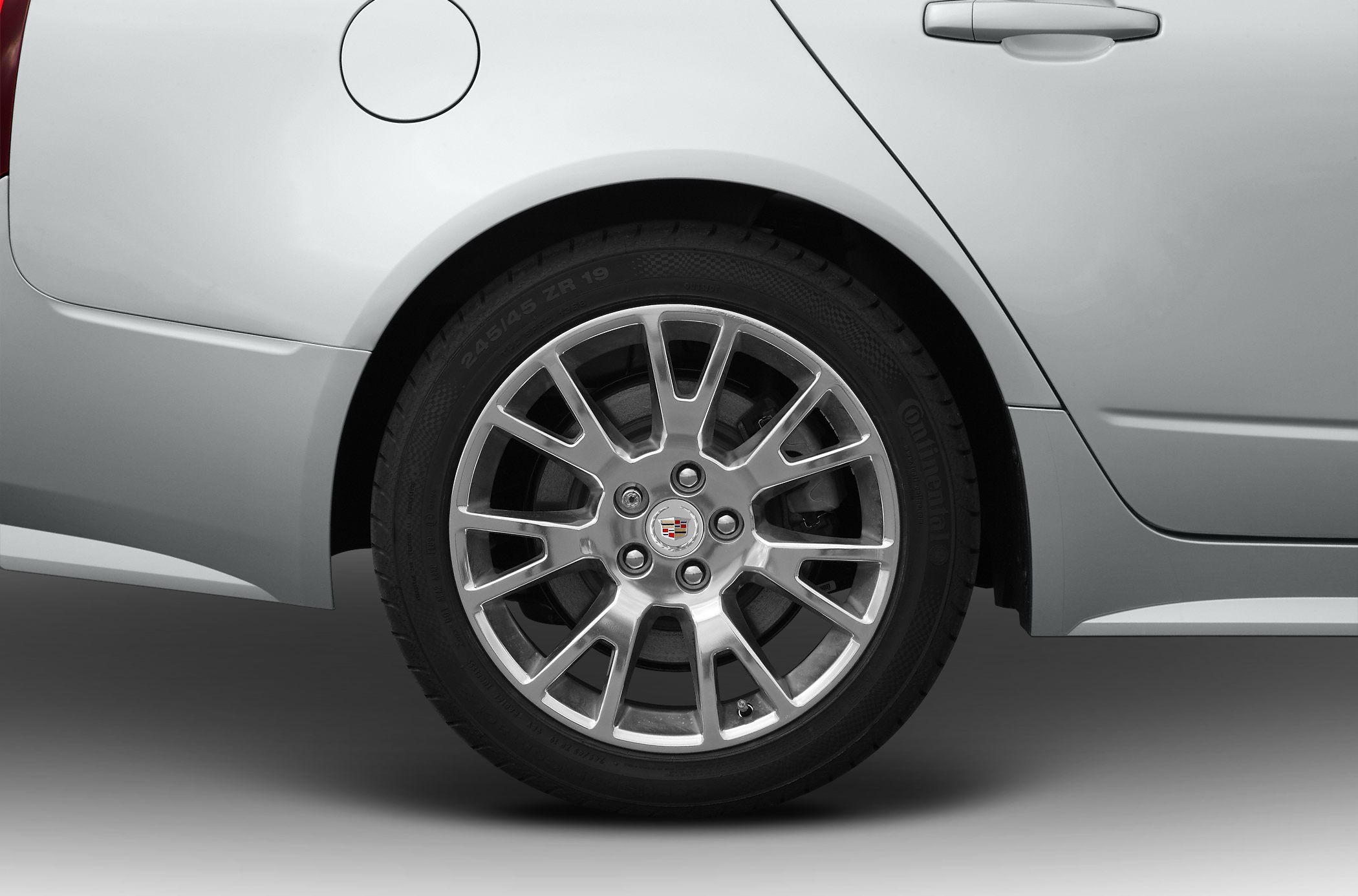 Rear alloy wheel and fuel cap on silver car side