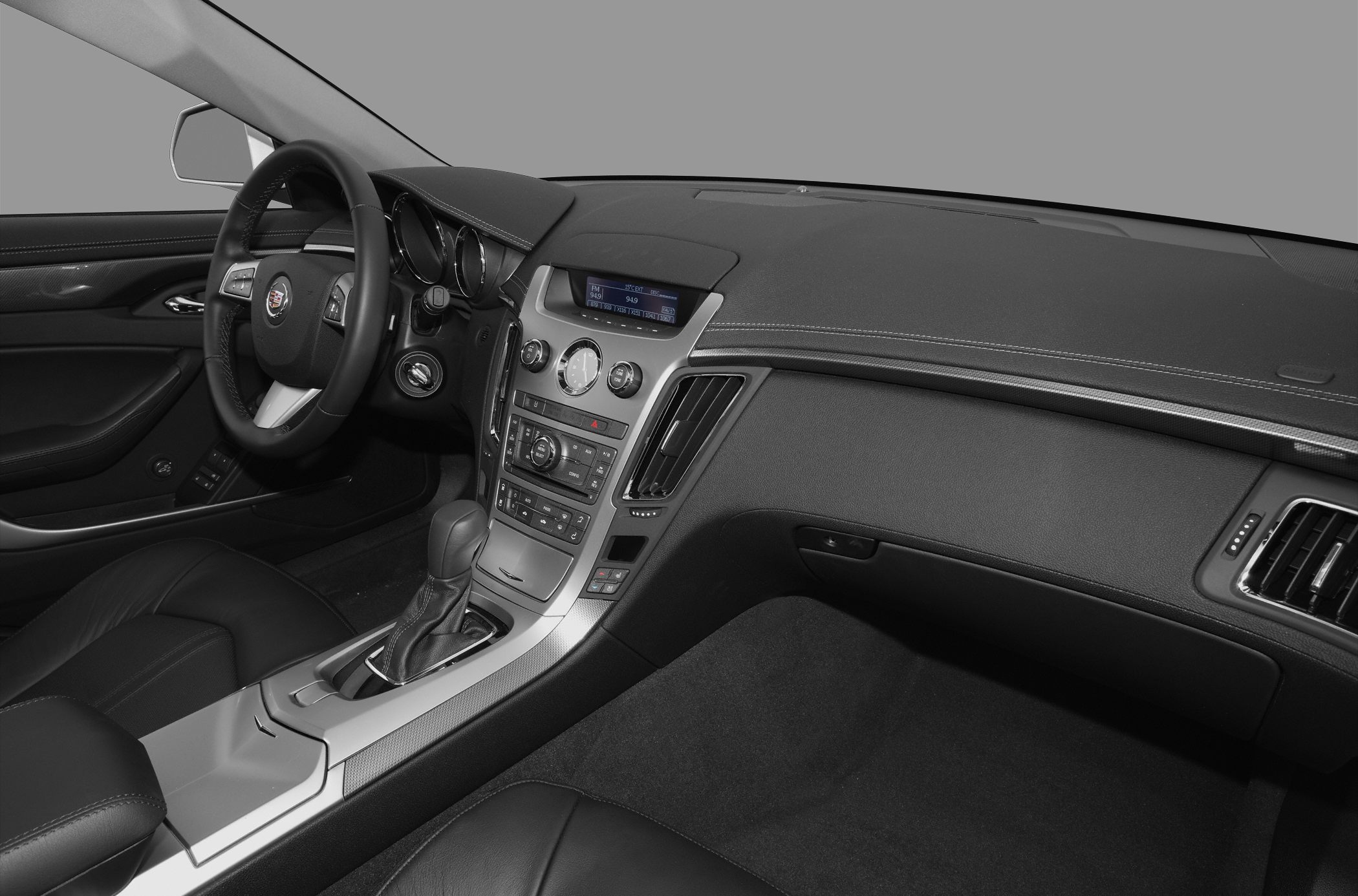 Luxury dashboard and center console with steering wheel and gear shift