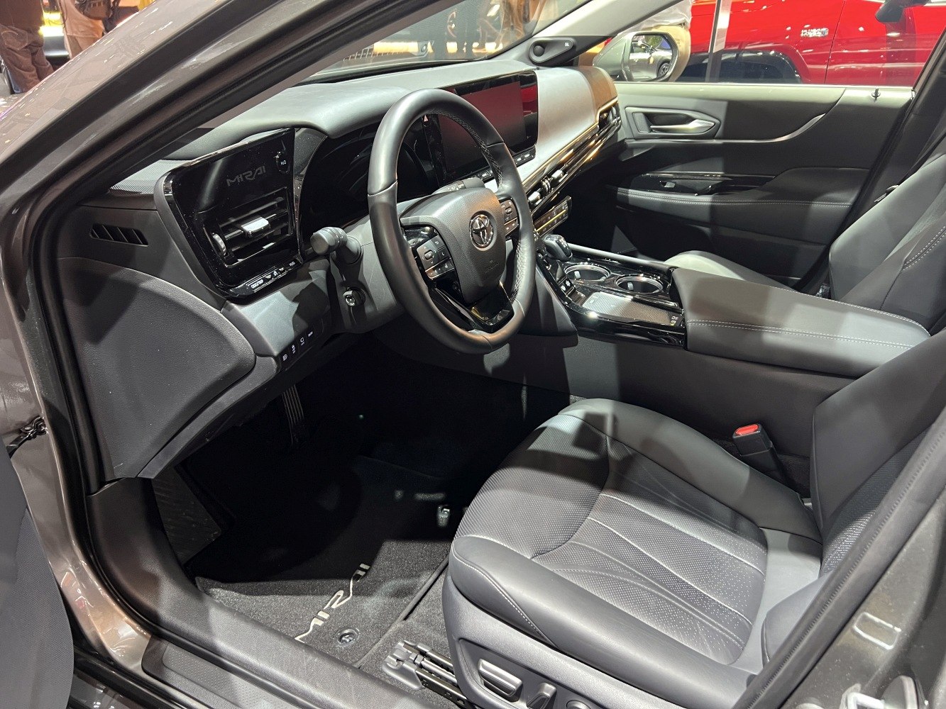Modern car interior with digital dashboard and ergonomic seats