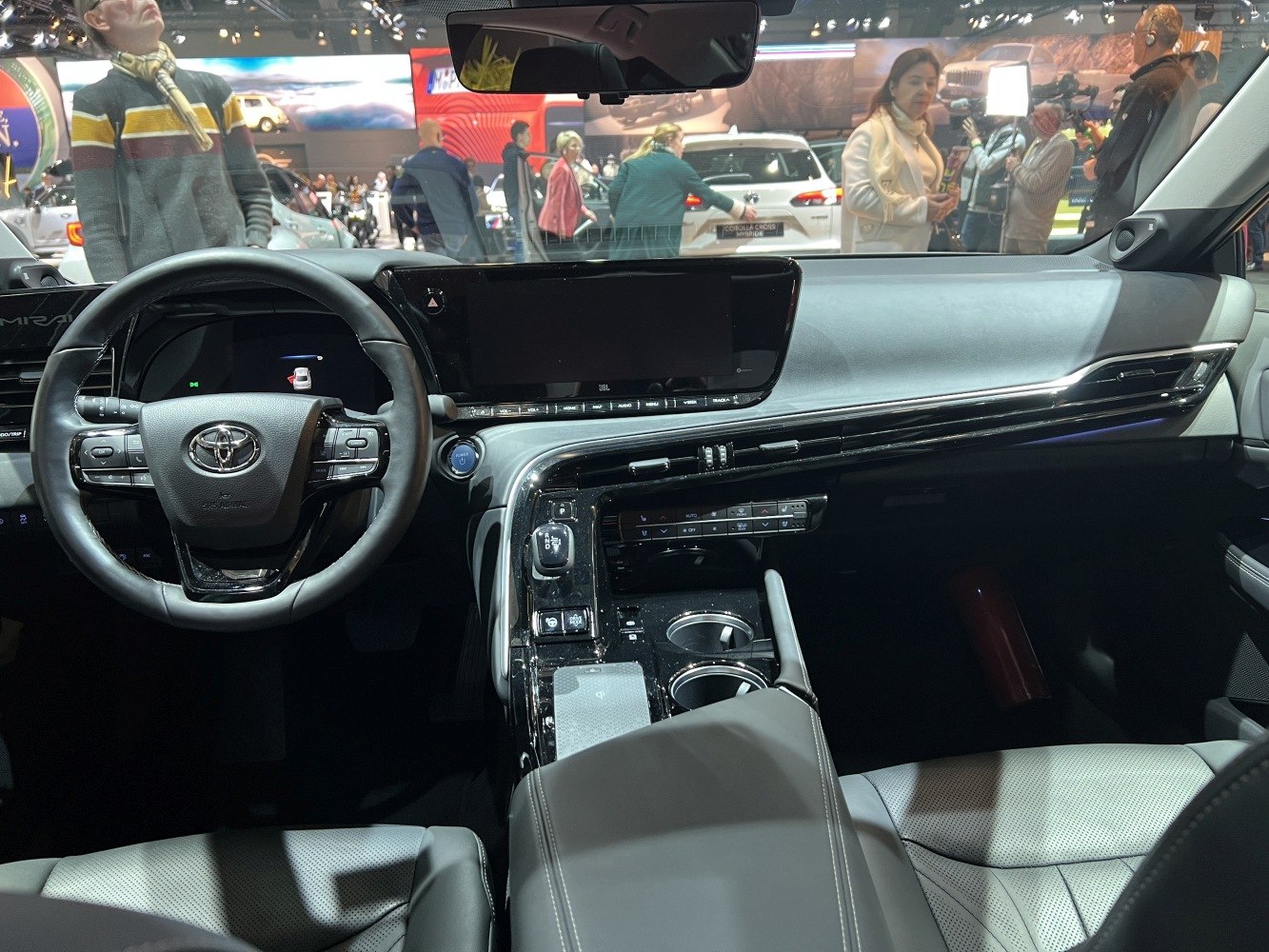 Modern dashboard and steering wheel with digital displays and control buttons