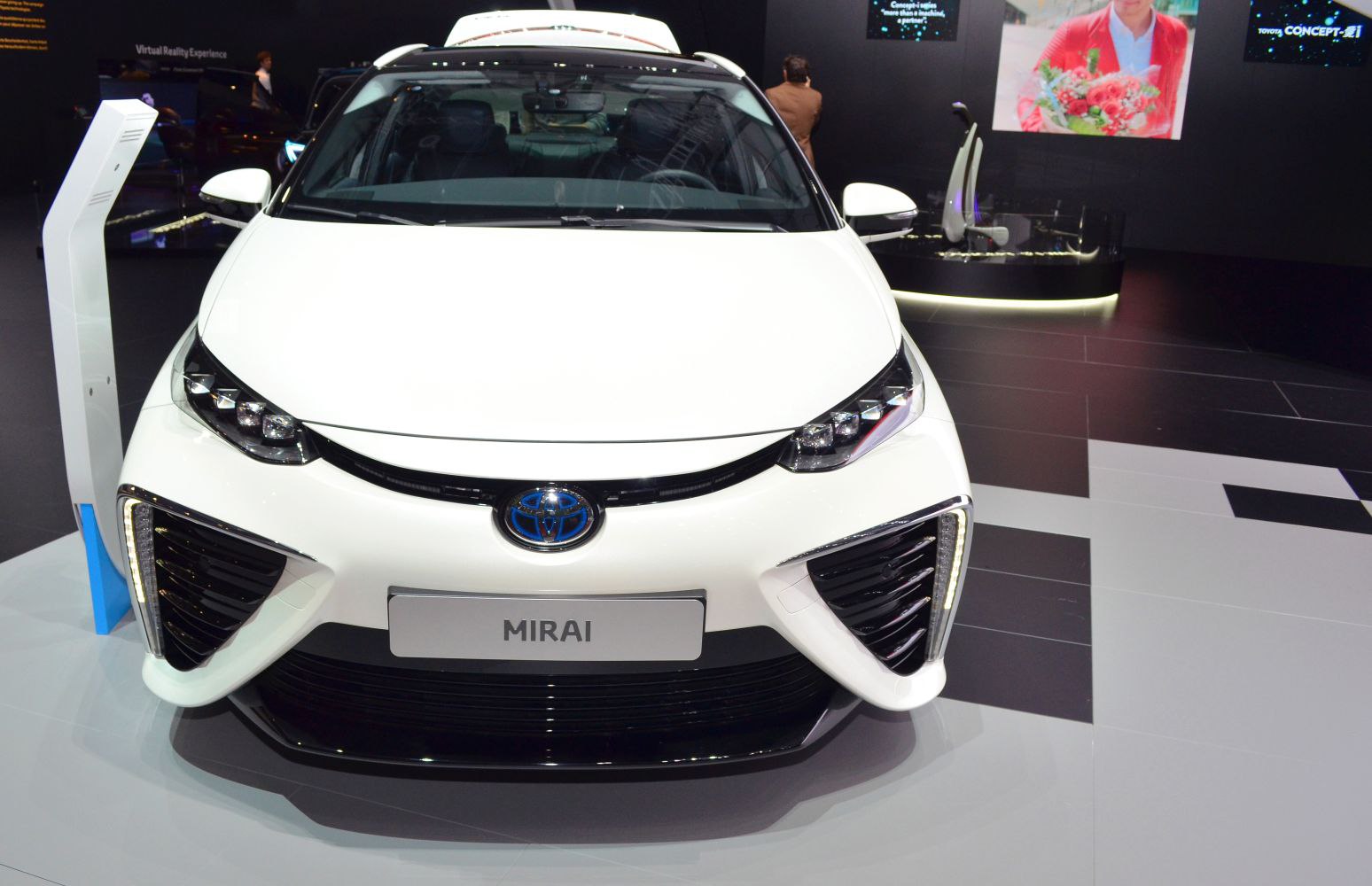 Front view with LED headlights and black grille of a white car