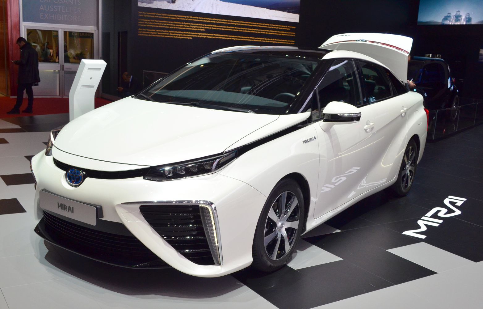 White sedan with sleek headlights and aerodynamic front design