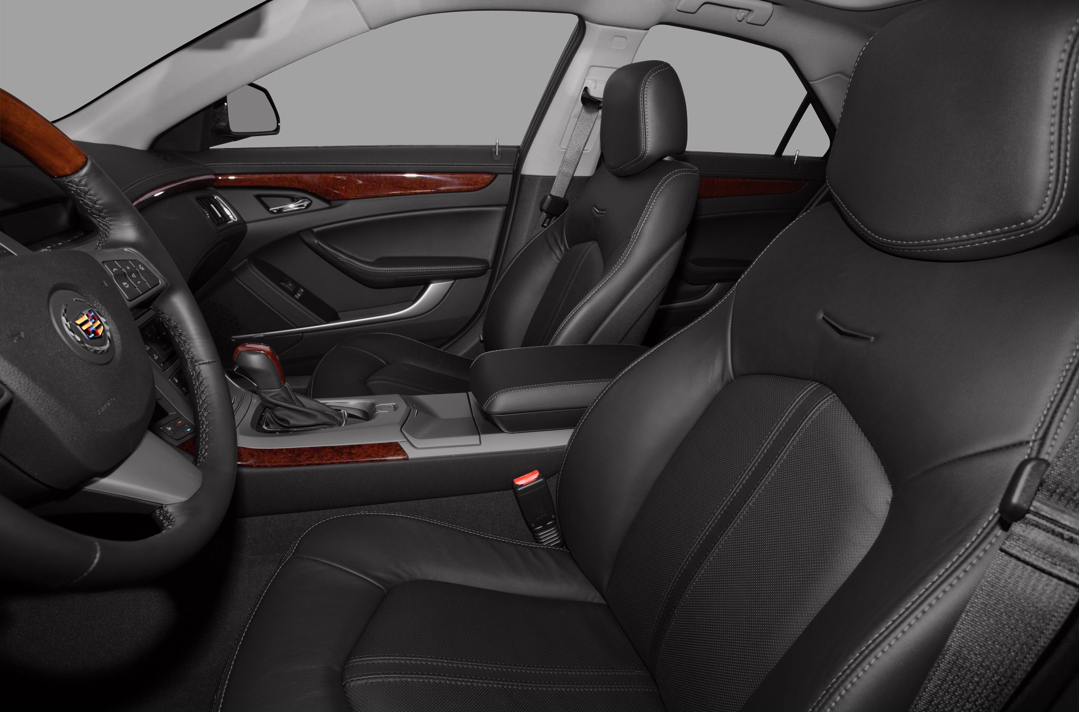 Luxury black leather seats and wood trim inside a sedan