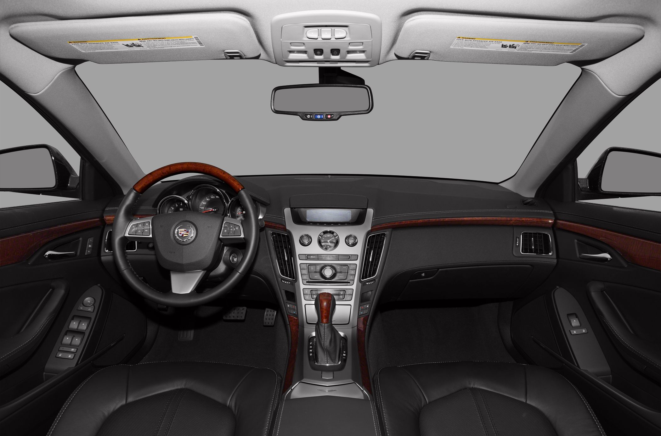 Luxury sedan interior with wood trim and advanced dashboard controls