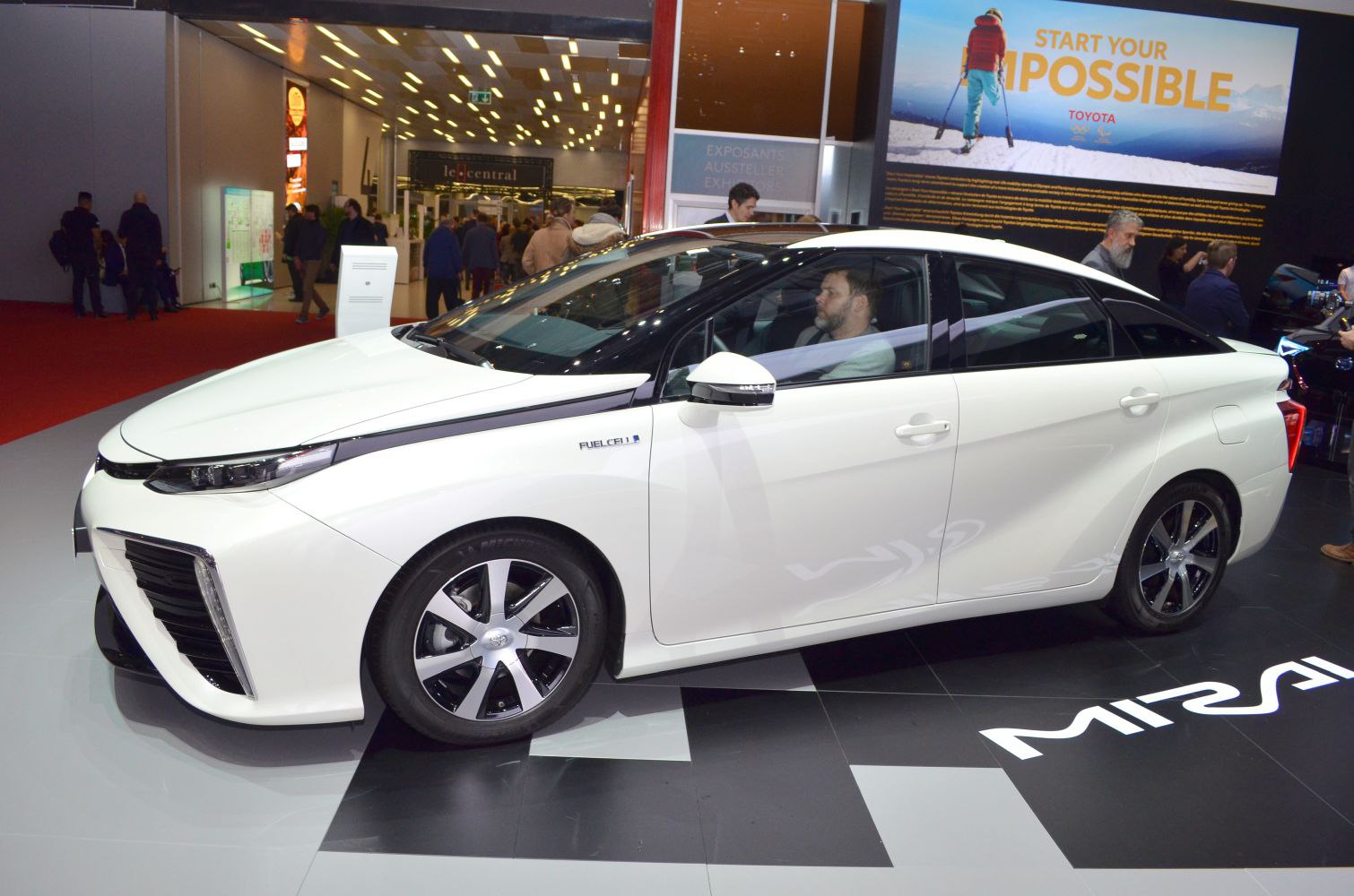 White fuel cell sedan with aerodynamic body and LED headlights