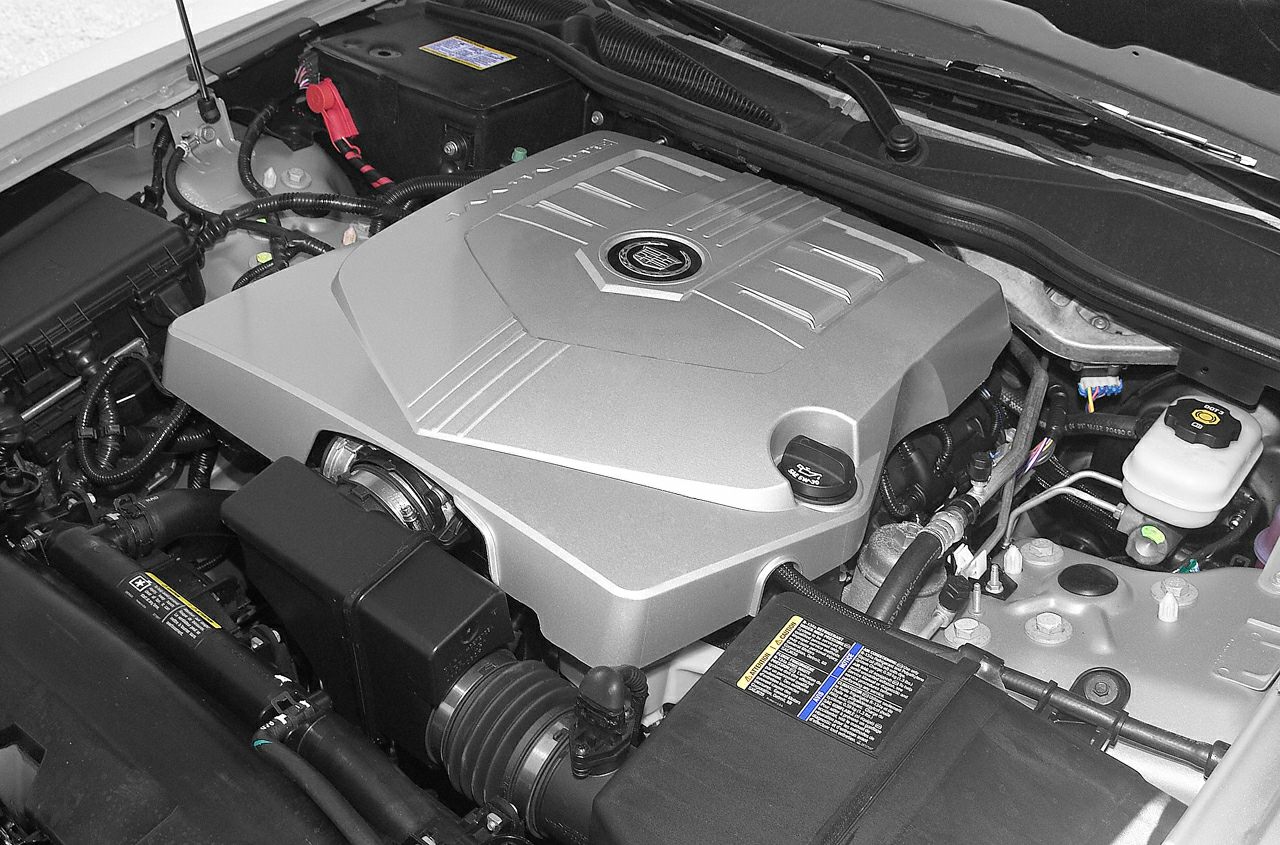V6 engine cover and surrounding components in vehicle engine bay