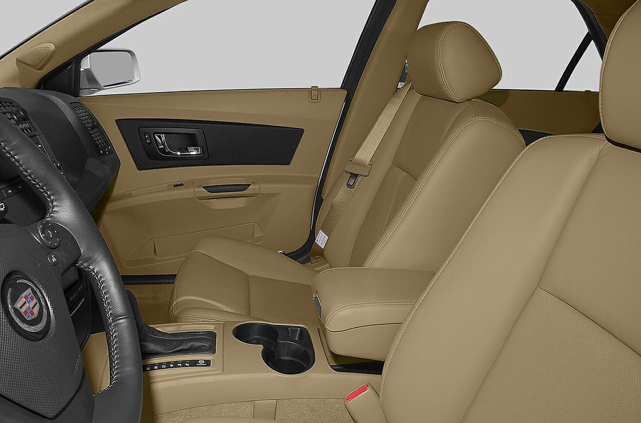 Front seats and center console with tan leather upholstery
