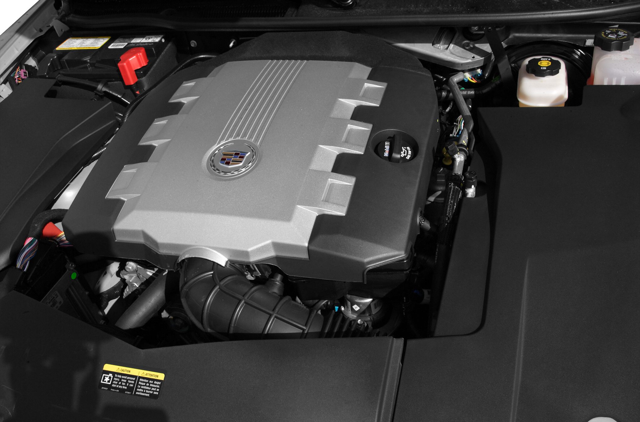 Engine compartment with detailed engine cover and fluid containers