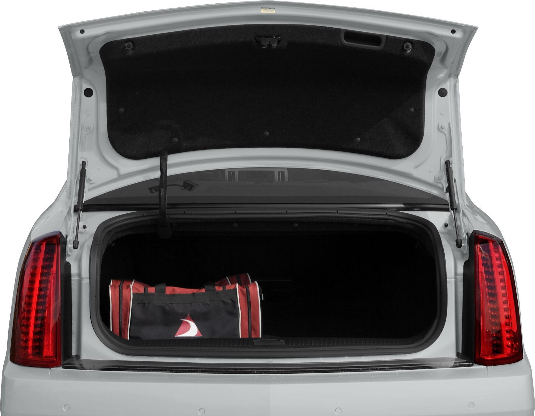 Open sedan trunk with vertical taillights and sports bag