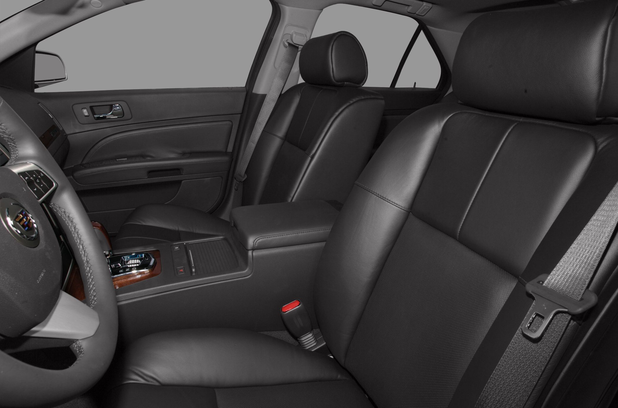 Black leather seats with central console and seatbelt