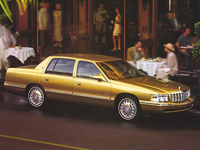 Gold classic sedan with front and side view, four-door design, and chrome details.