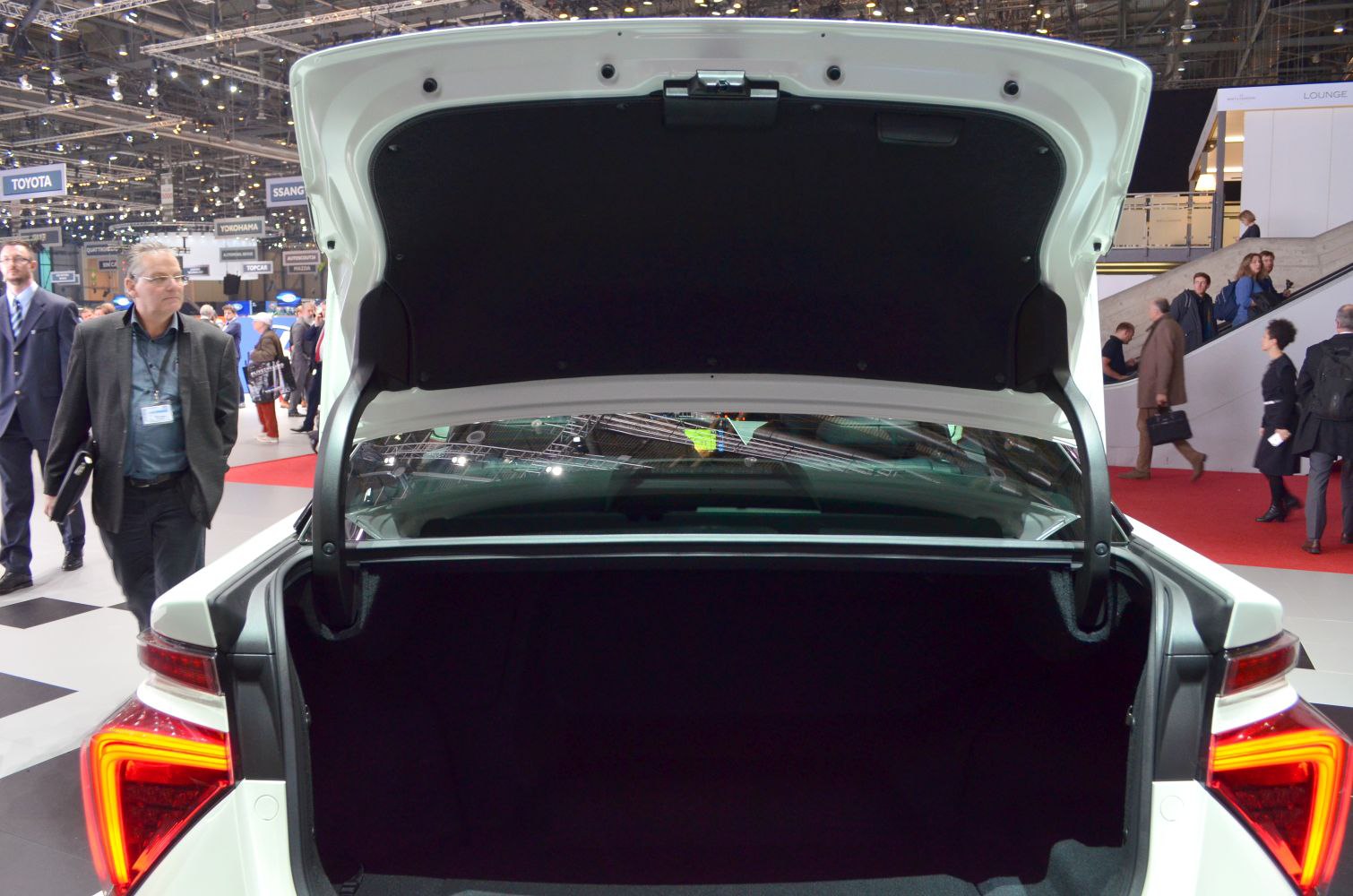 Open trunk of a modern vehicle with distinctive rear light design