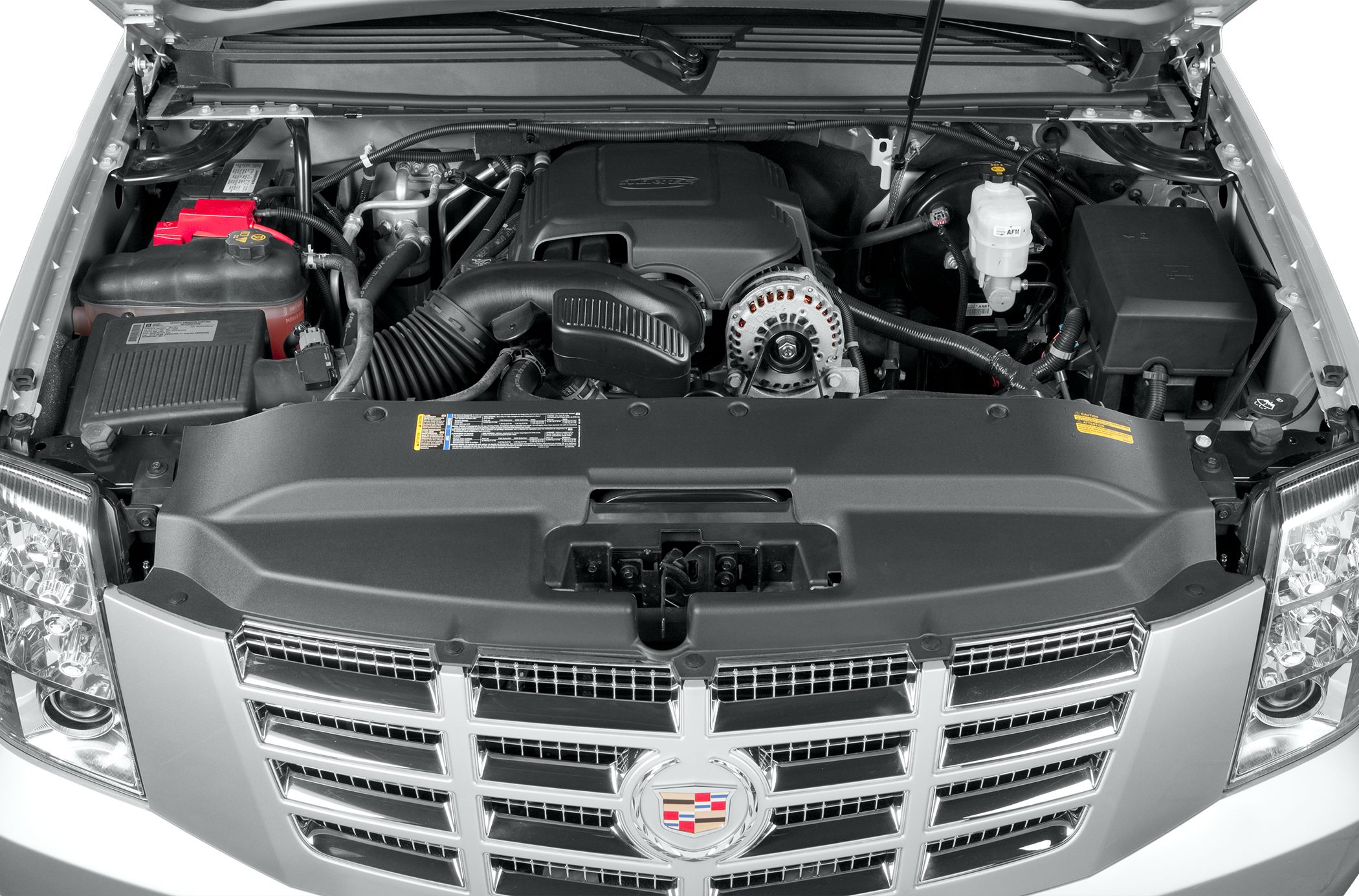 Close-up of engine bay and front grille with emblem