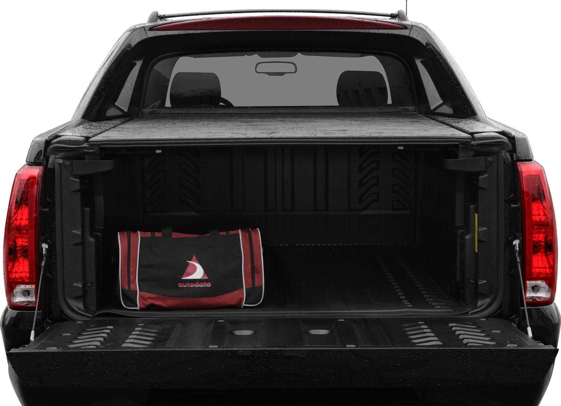 Open pickup truck bed with bed liner and tailgate down.