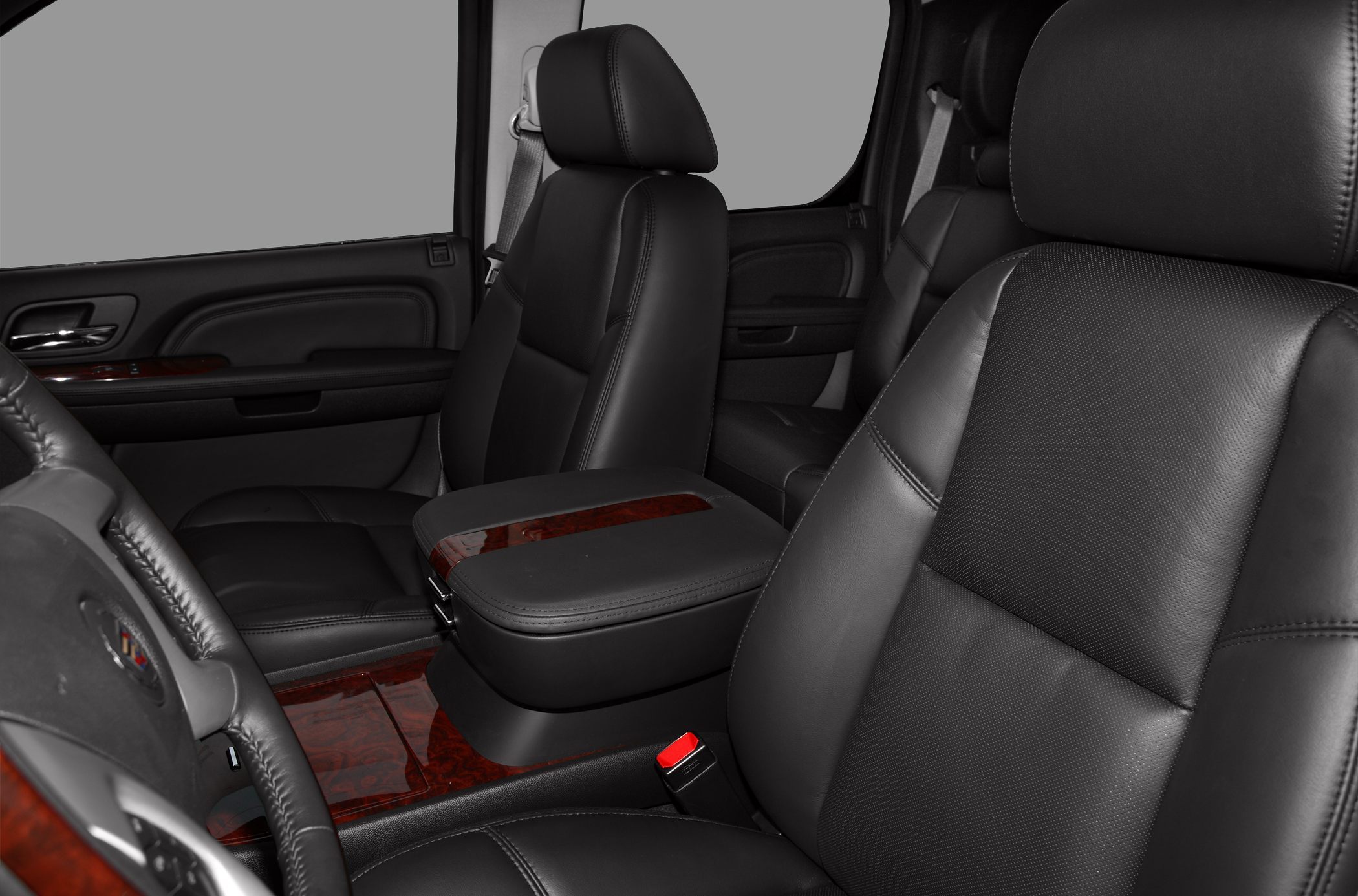 Black leather seats with wood trim and cushioned armrest