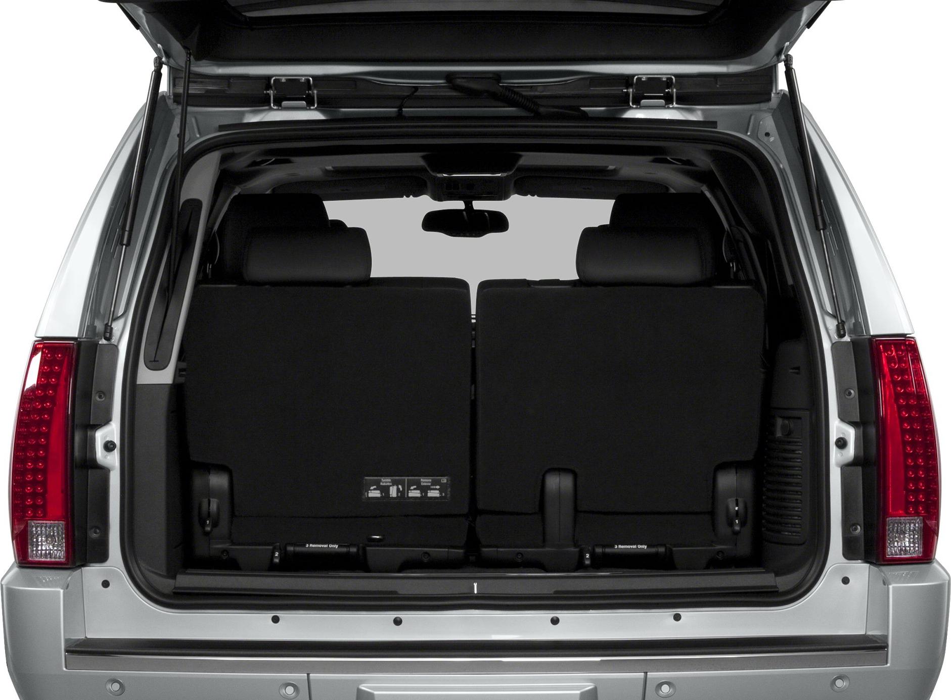 Open rear hatch showing foldable third-row seats and spacious cargo area.