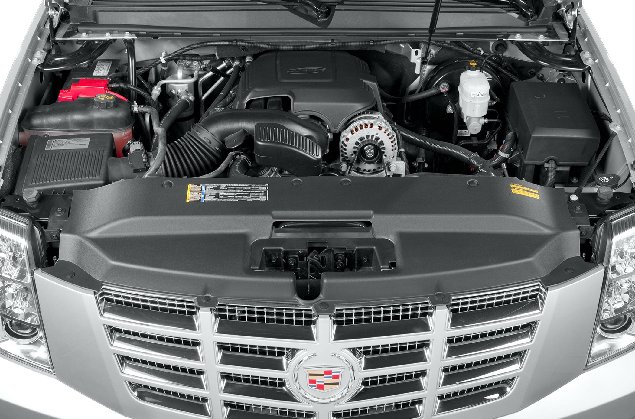 Engine bay with prominent front grille and Cadillac emblem
