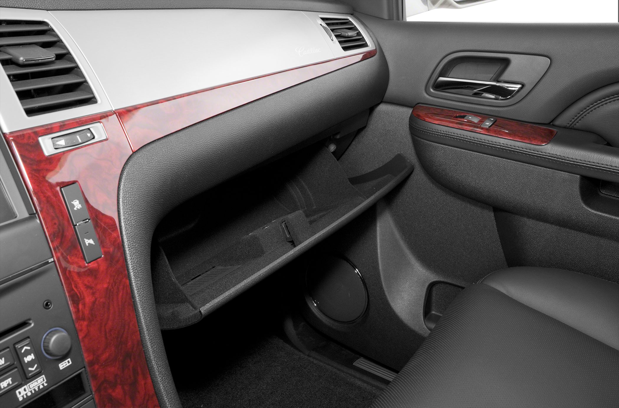Dashboard and wood trim with open glove compartment and luxury seating