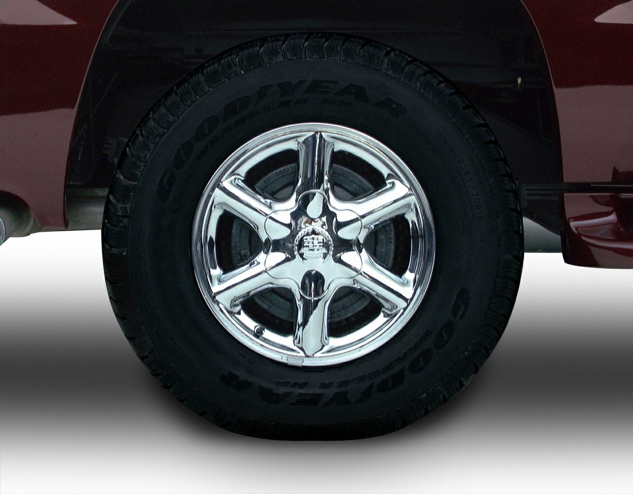 Chrome five-spoke wheel with Goodyear tire