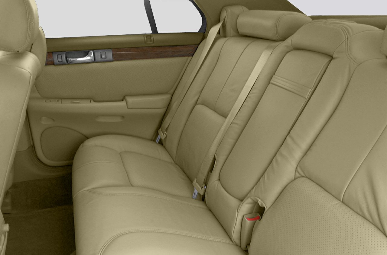 Beige leather rear seats with wood trim door panel