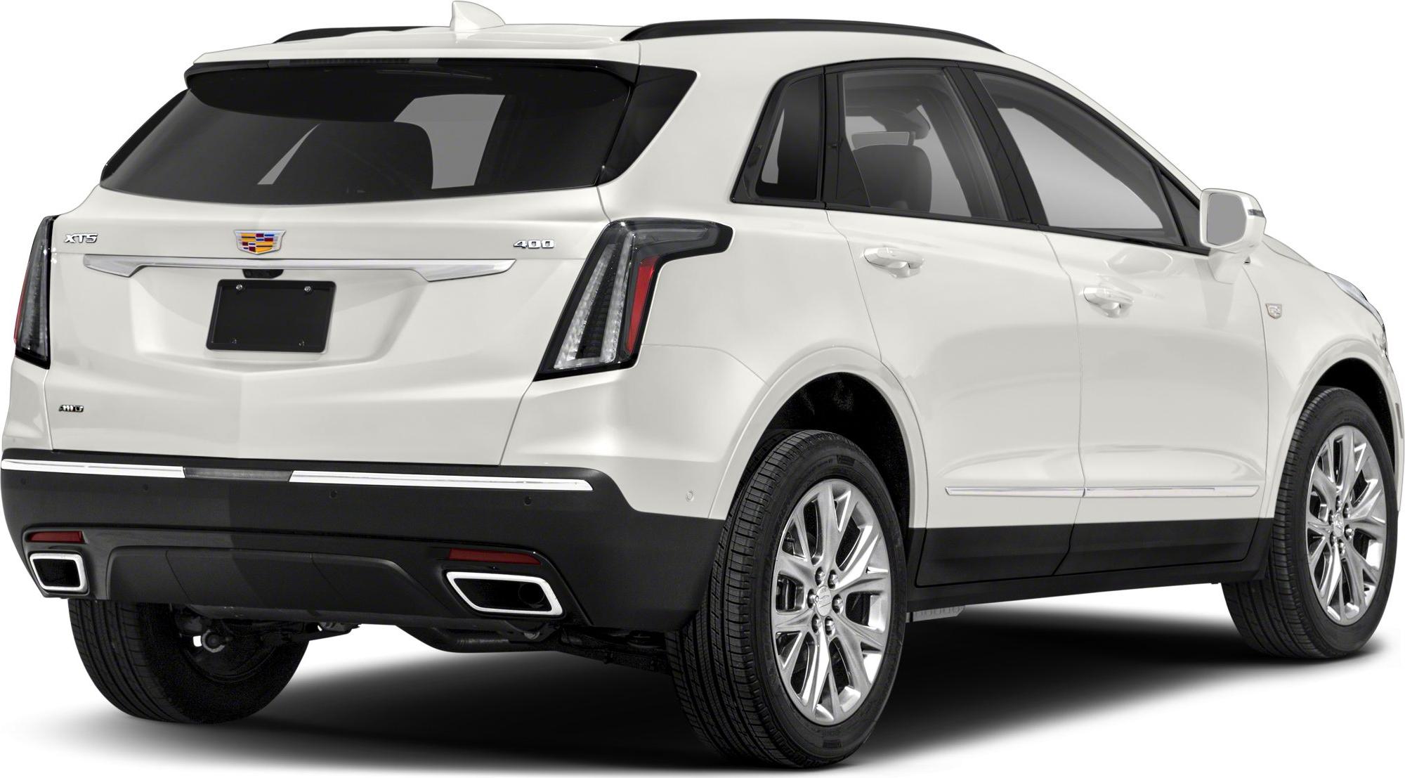 Rear view of a white SUV with vertical taillights and dual exhaust outlets