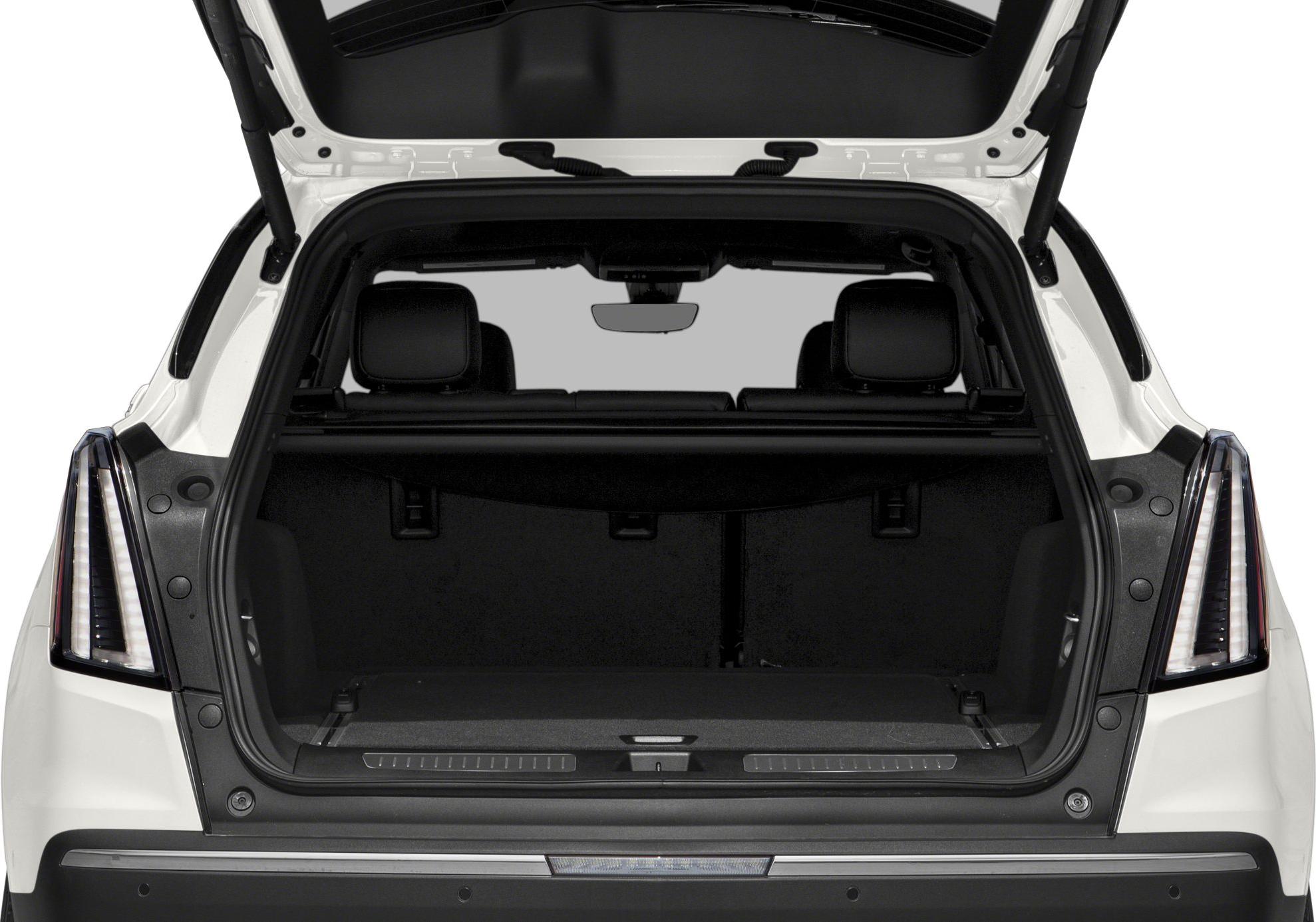 Open rear trunk with spacious cargo area and rear seats visible.