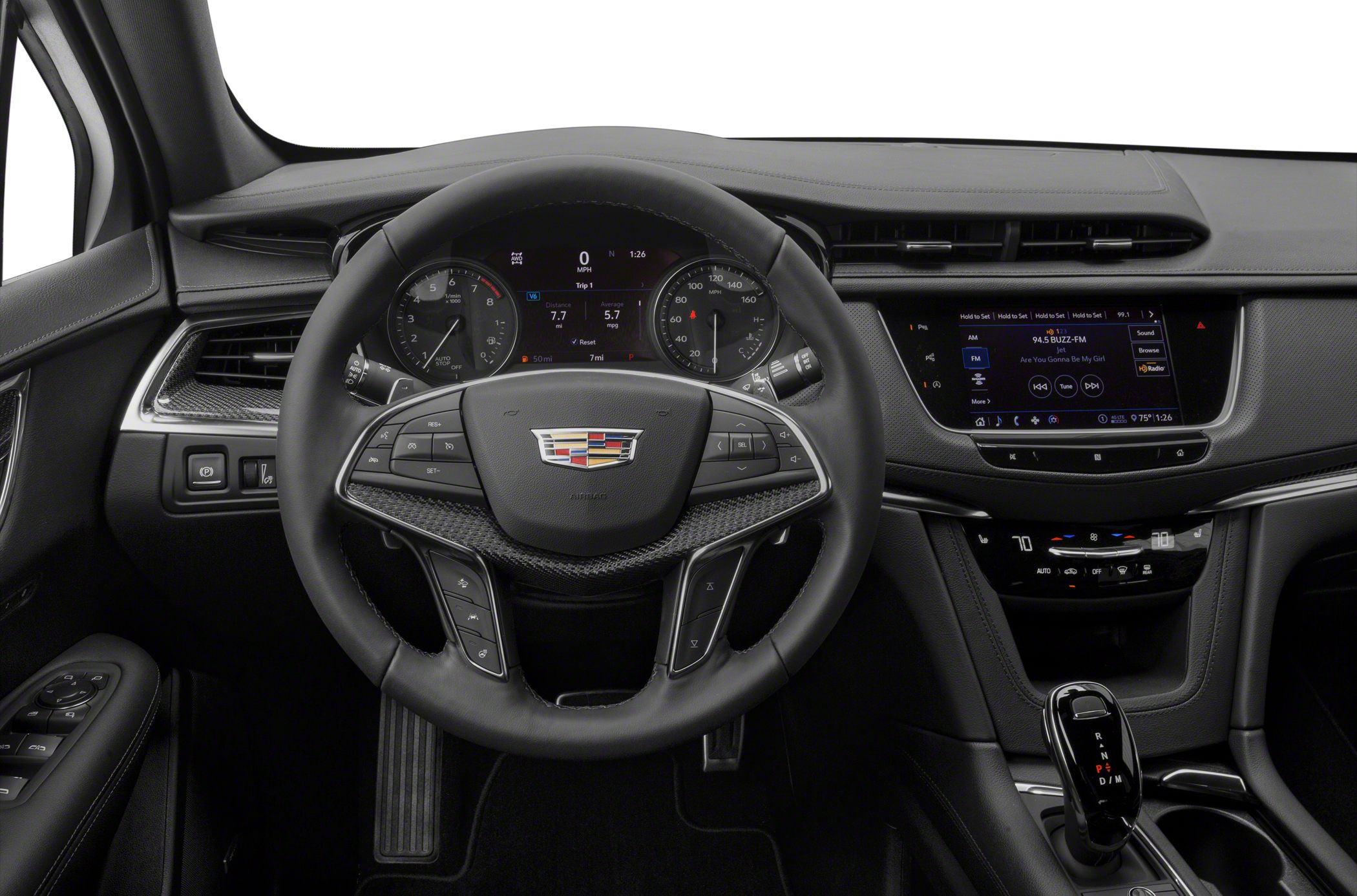Steering wheel, digital instrument cluster, infotainment system, climate control panel.