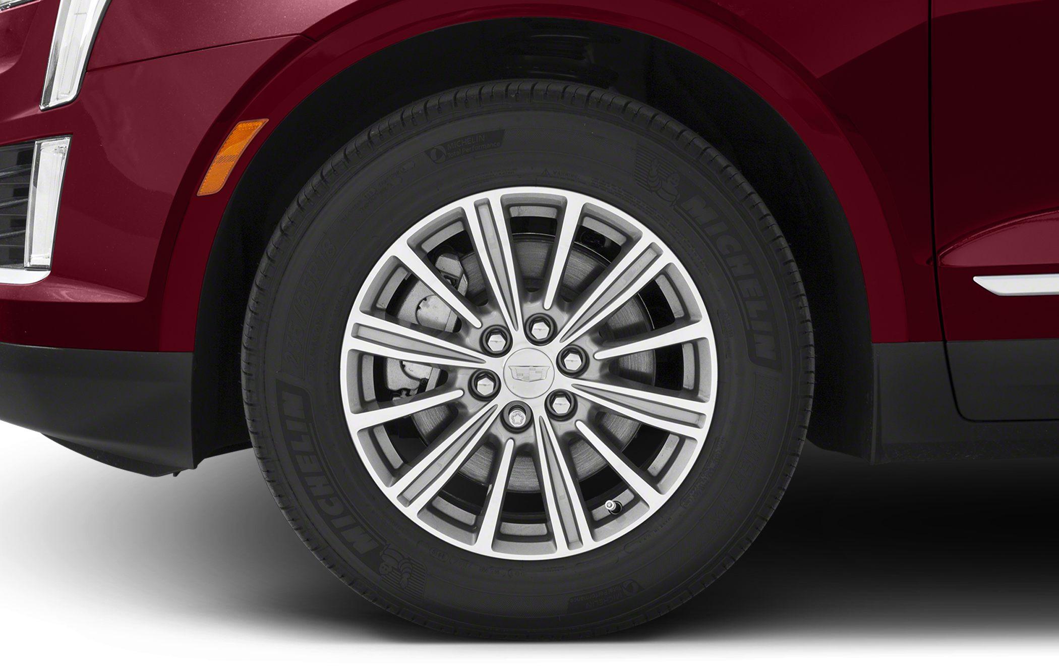 Alloy wheel with Michelin tire and visible brake caliper.