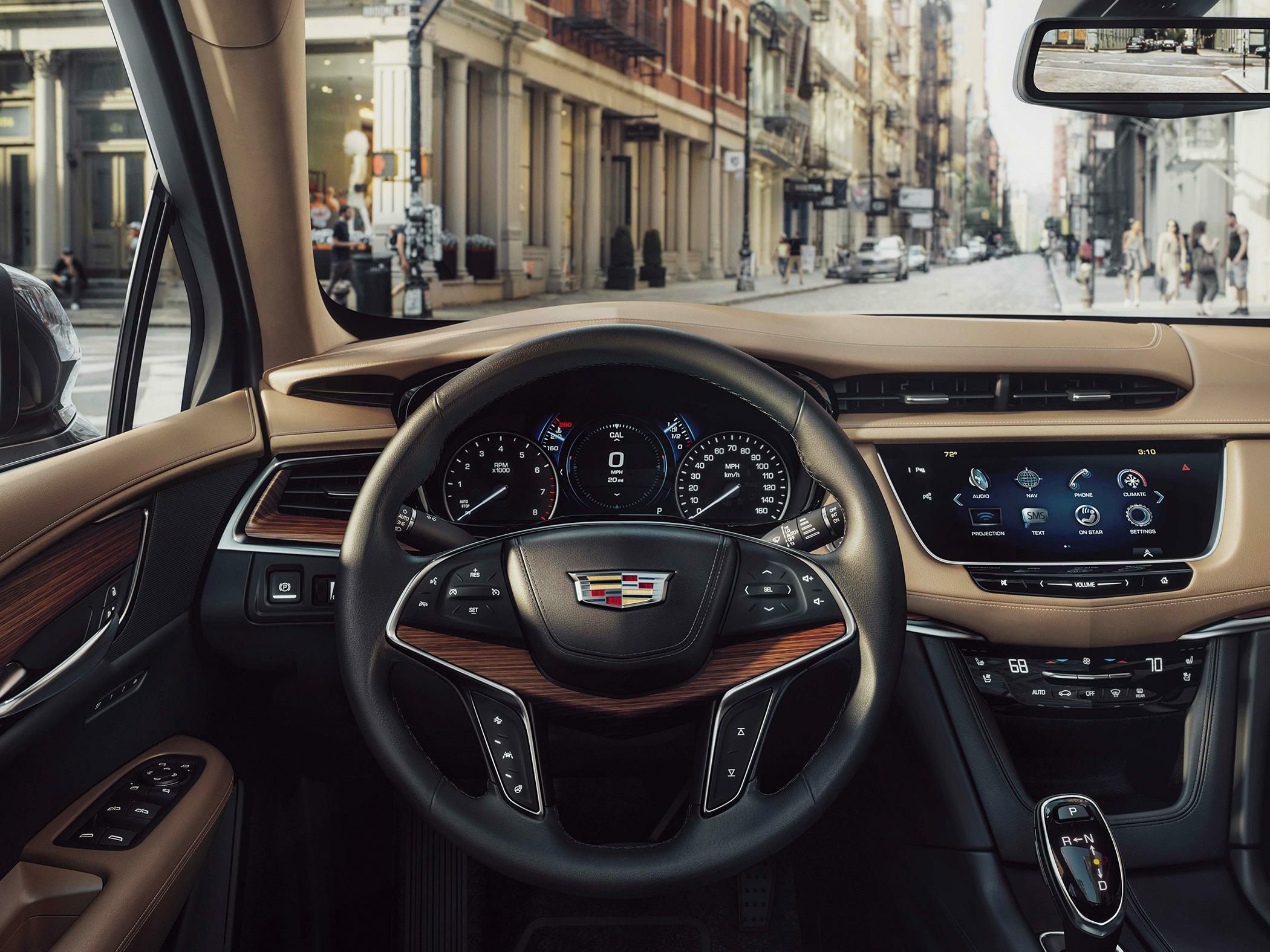 Luxury SUV interior with digital cluster and modern infotainment