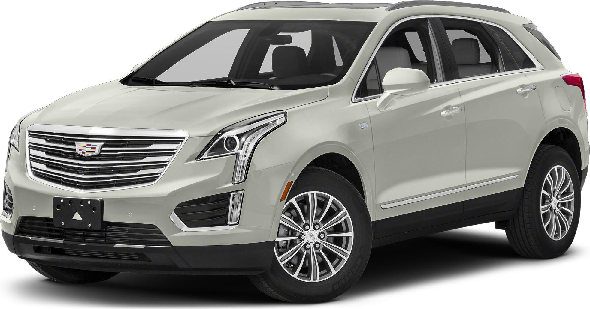 Luxury SUV front view with LED headlights and chrome grille.