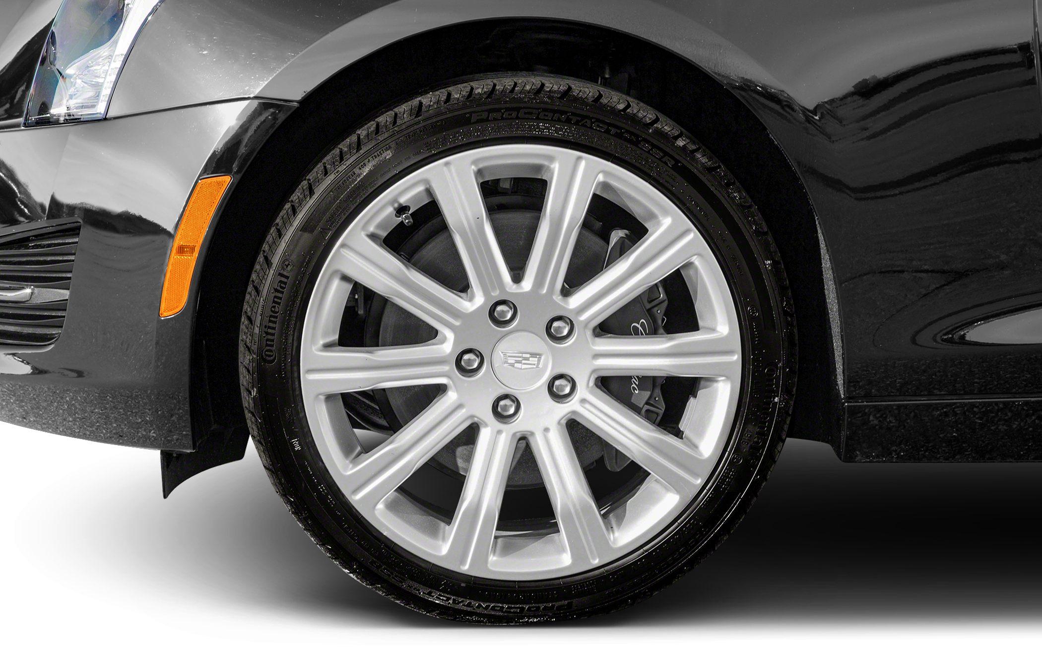 Close-up of alloy wheel and brake caliper with Continental tire