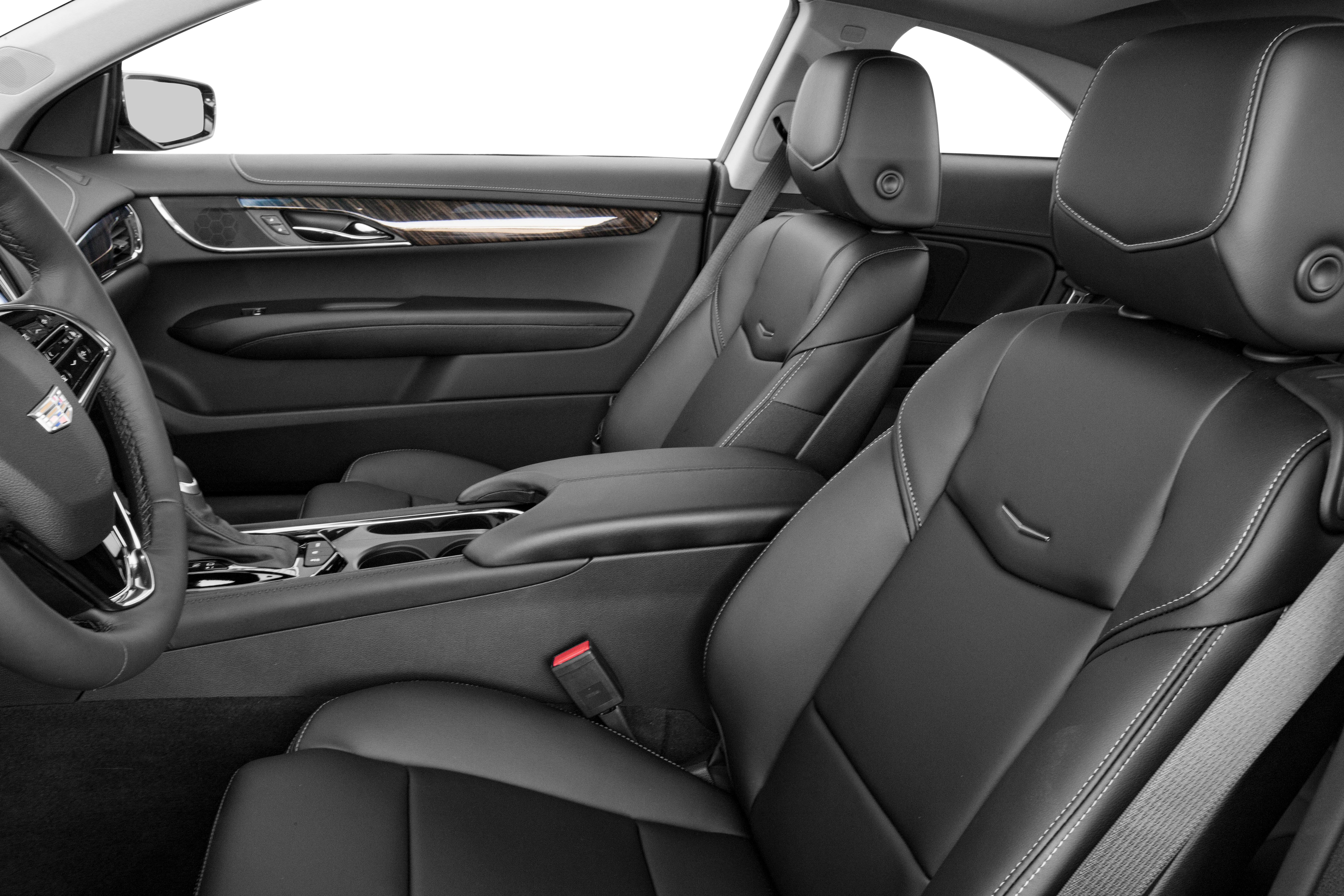 Black leather seats and elegant dashboard with wood trim