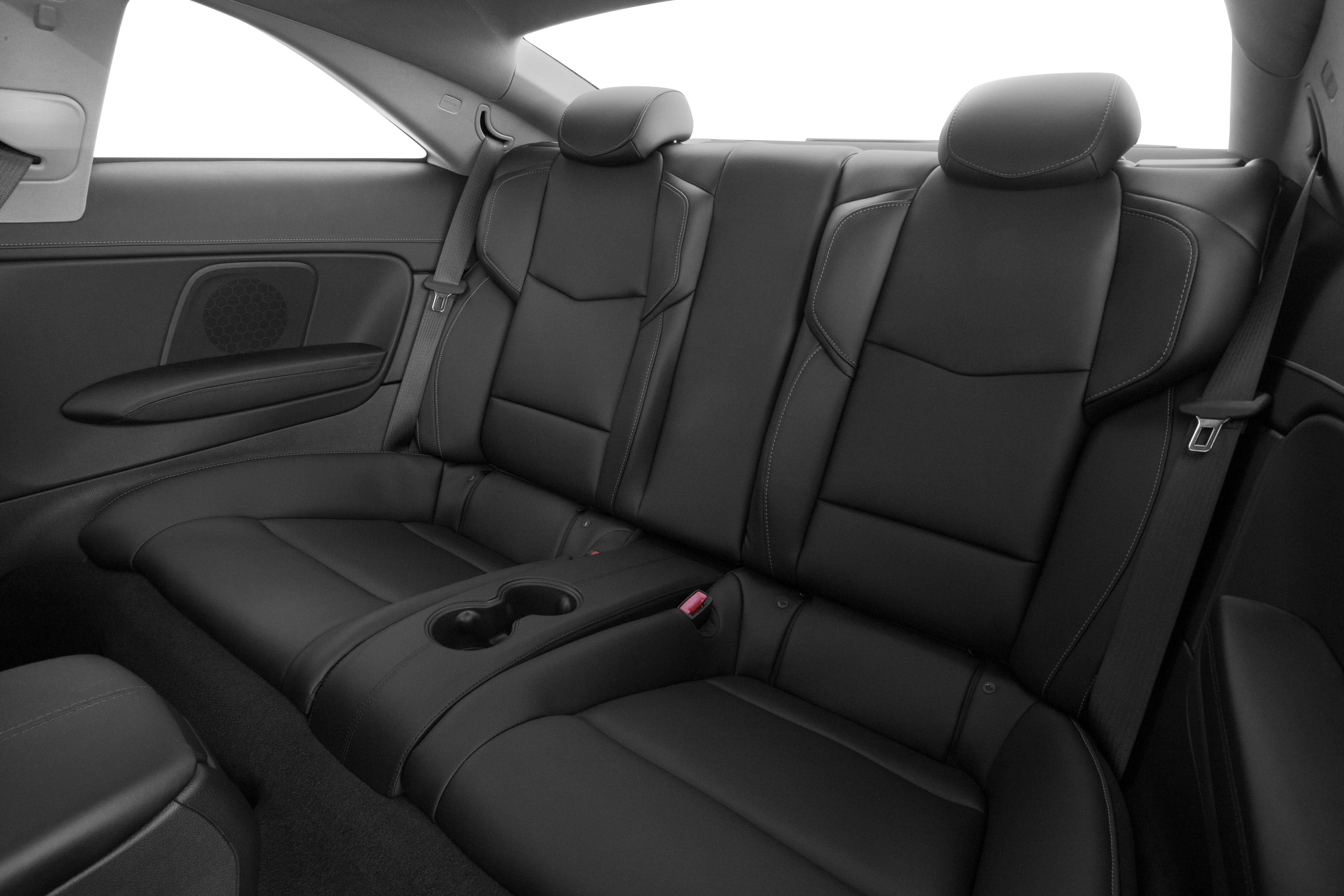 Black leather rear seats with cup holders and seat belts.